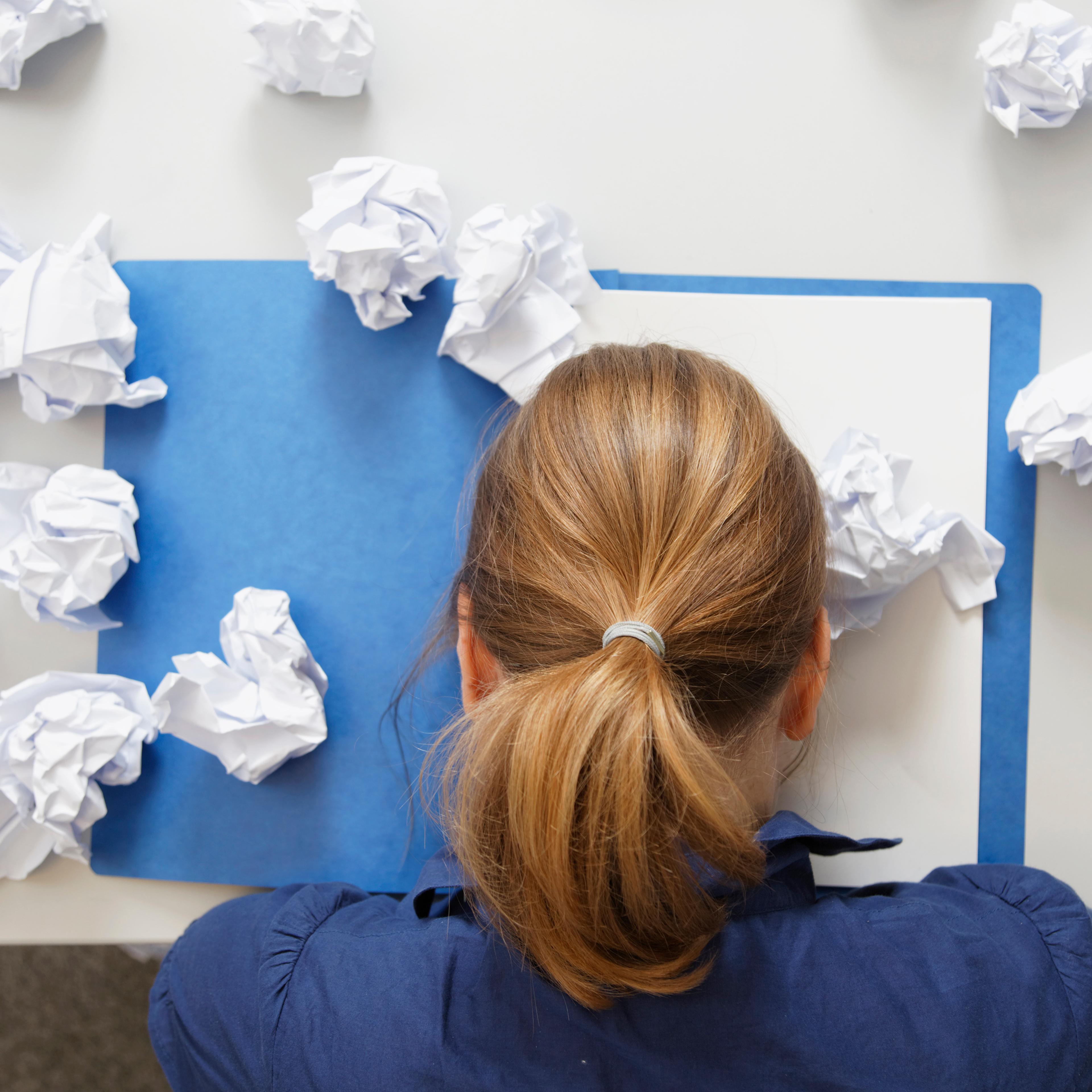 Germany, Businesswoman with file on table
