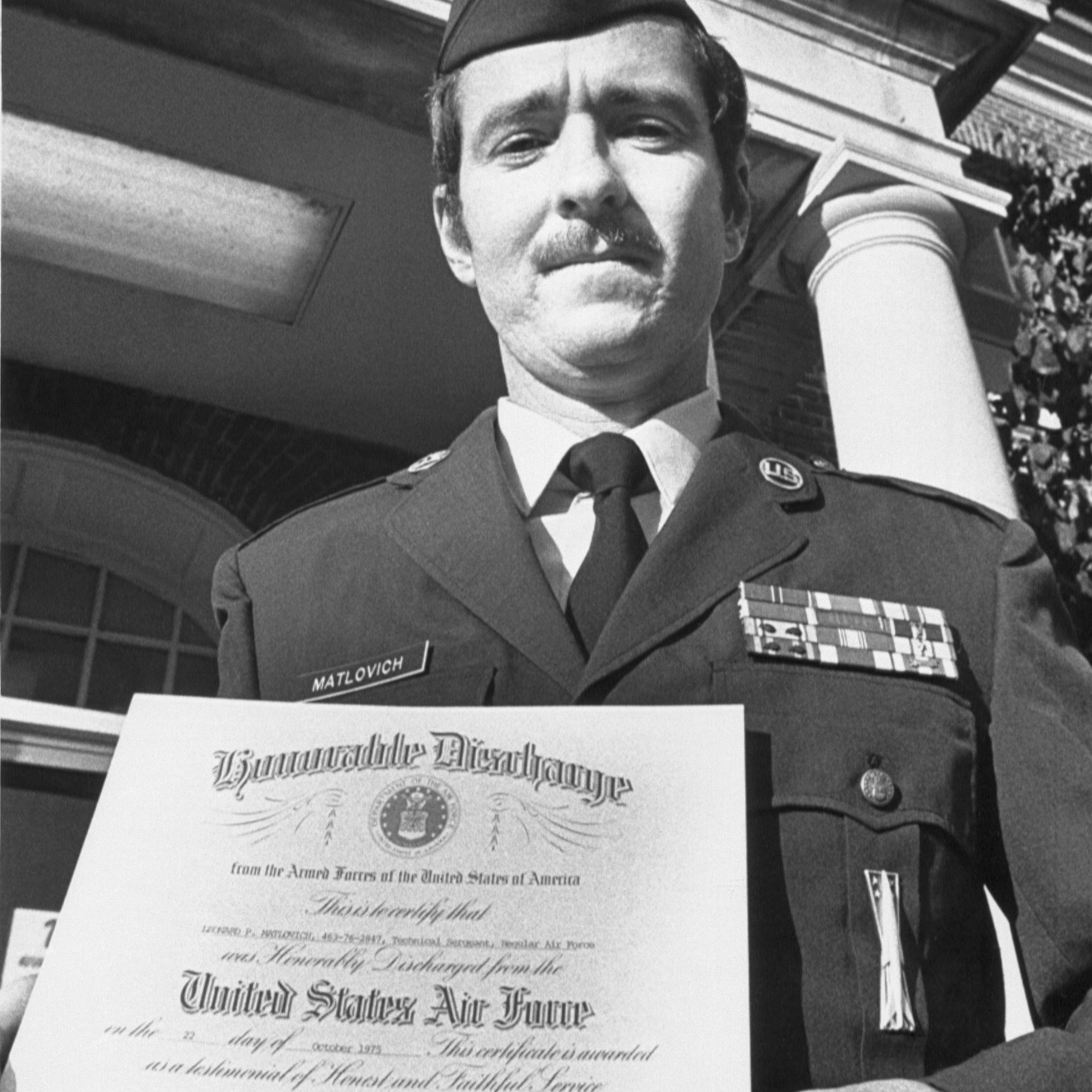 A United States Air Force Sergeant holds his Honorable Discharge papers in 1975. He was discharged from the service because he was gay
