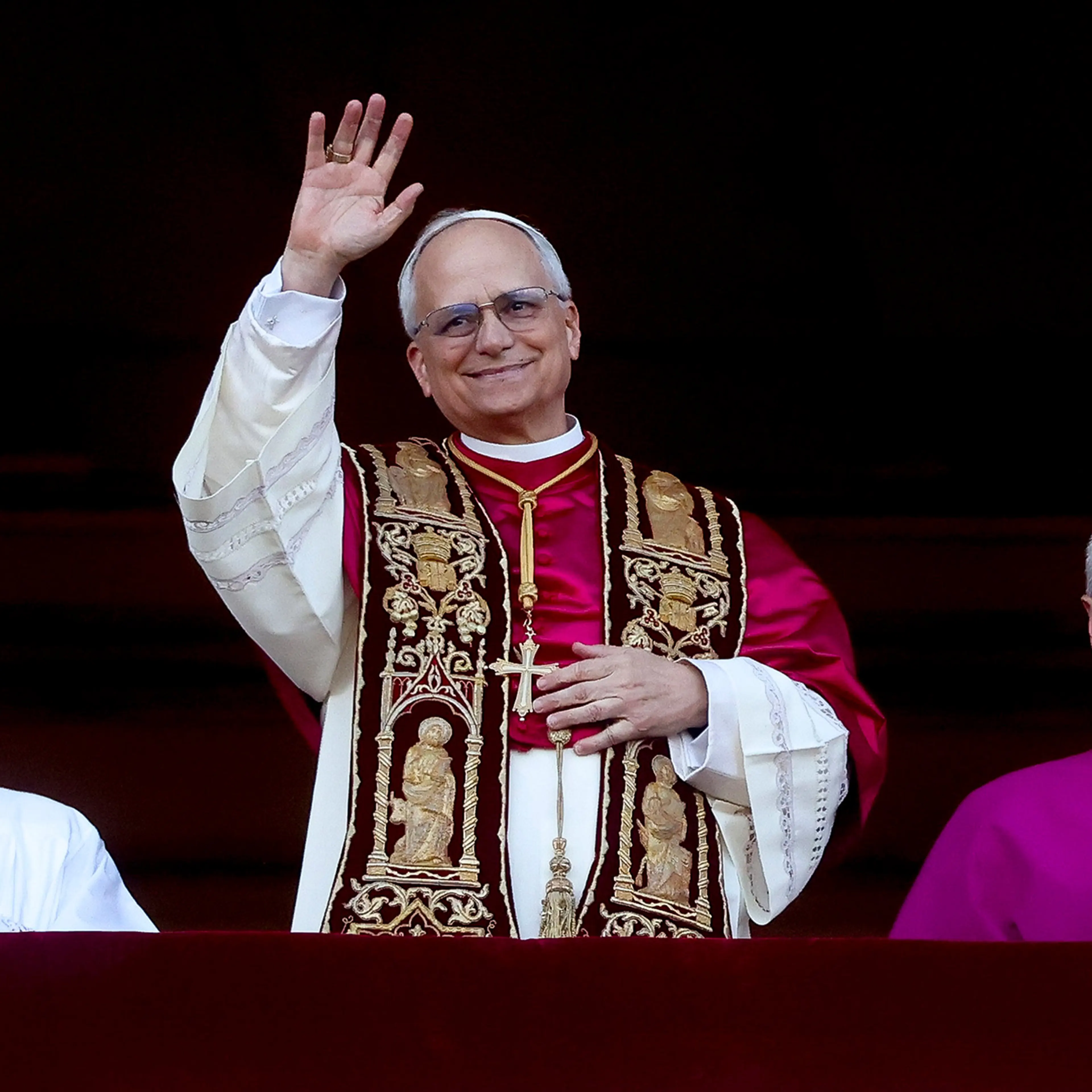 Newly elected Pope Leo XIV, Cardinal Robert Francis Prevost, greets the faithful as he appears from the Central Loggia of St. Peter's Square on May 8, 2025 in Vatican City, Vatican.