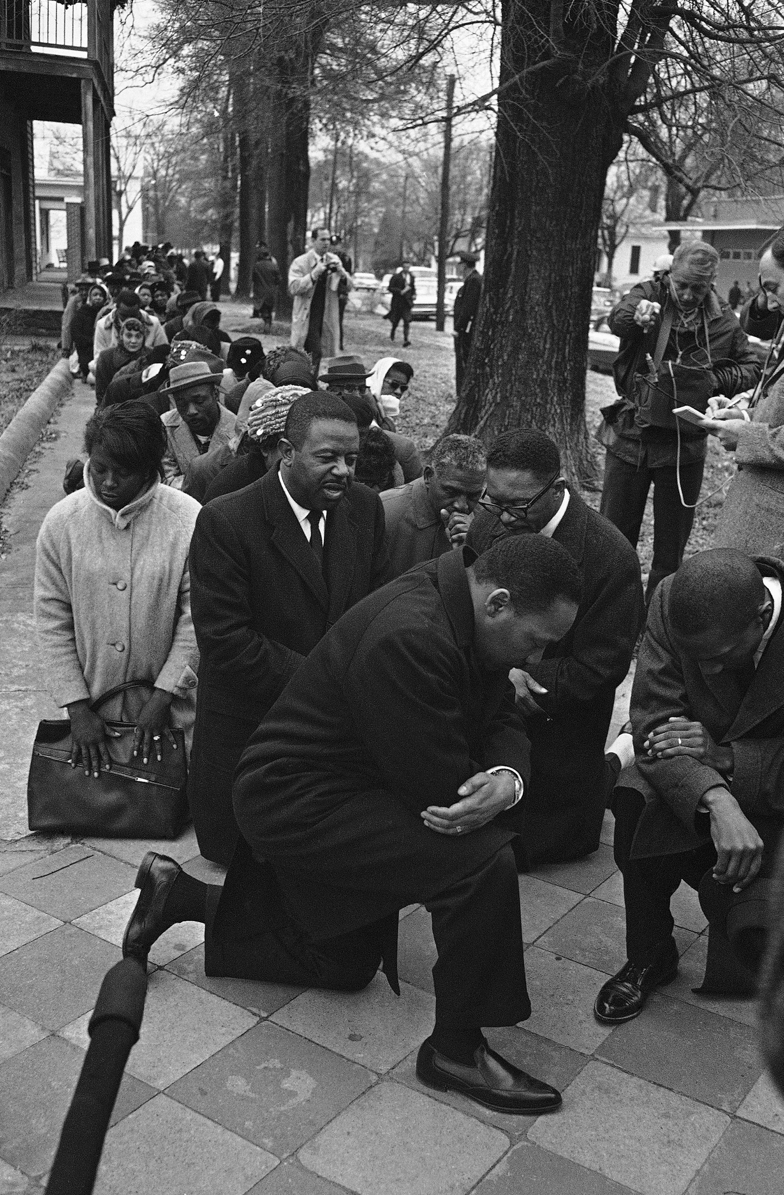 Dr. Martin Luther King Jr., center, leads a group of civil rights workers and Selma black people in prayer on Feb. 1, 1965 in Selma, Alabama after they were arrested on charges of parading without a permit. More than 250 persons were arrested as they mar