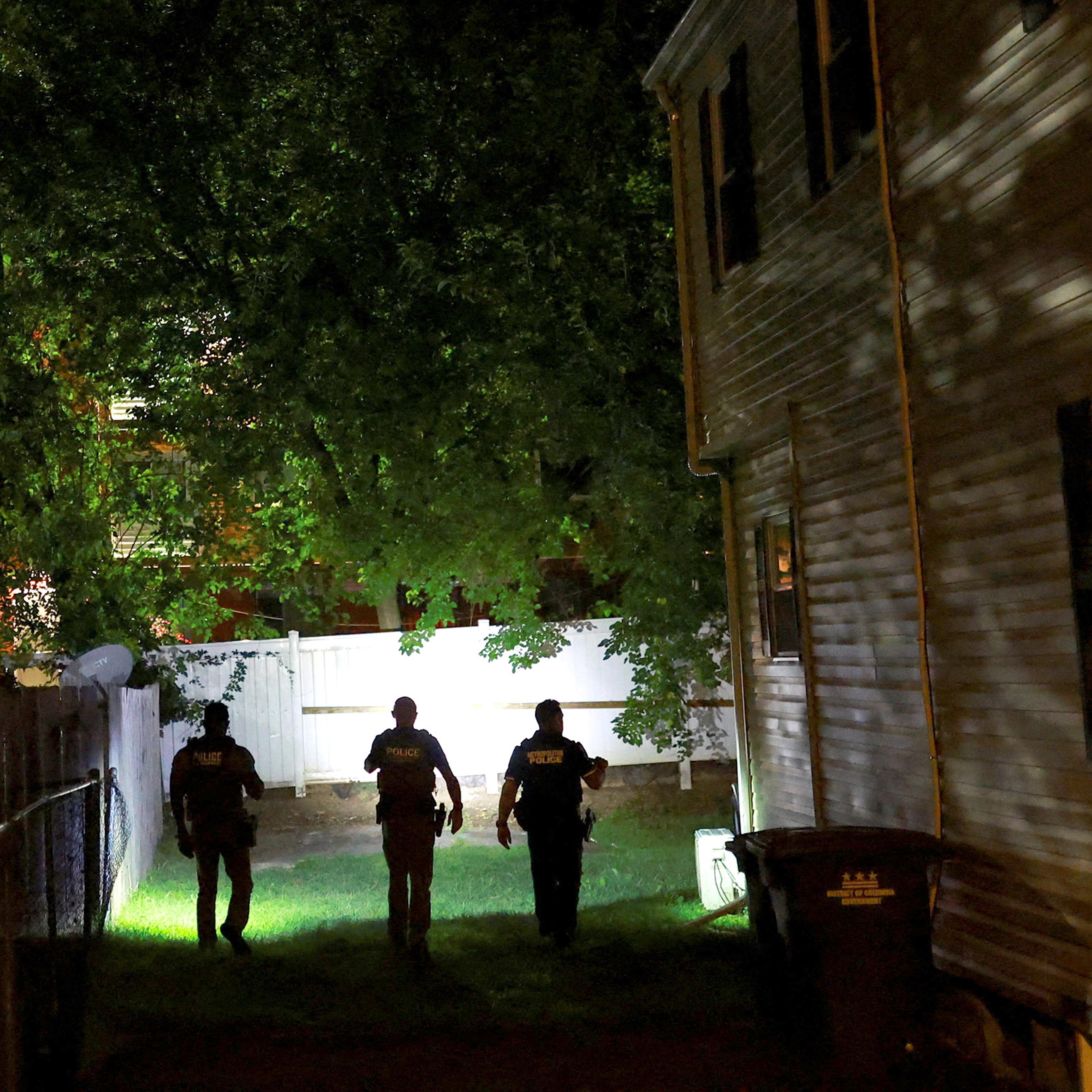 Federal agents and a police officer conduct a surveillance patrol in Washington, D.C., after President Trump deployed the National Guard and ordered an increased presence of federal law enforcement to assist in crime prevention, Aug. 23, 2025.