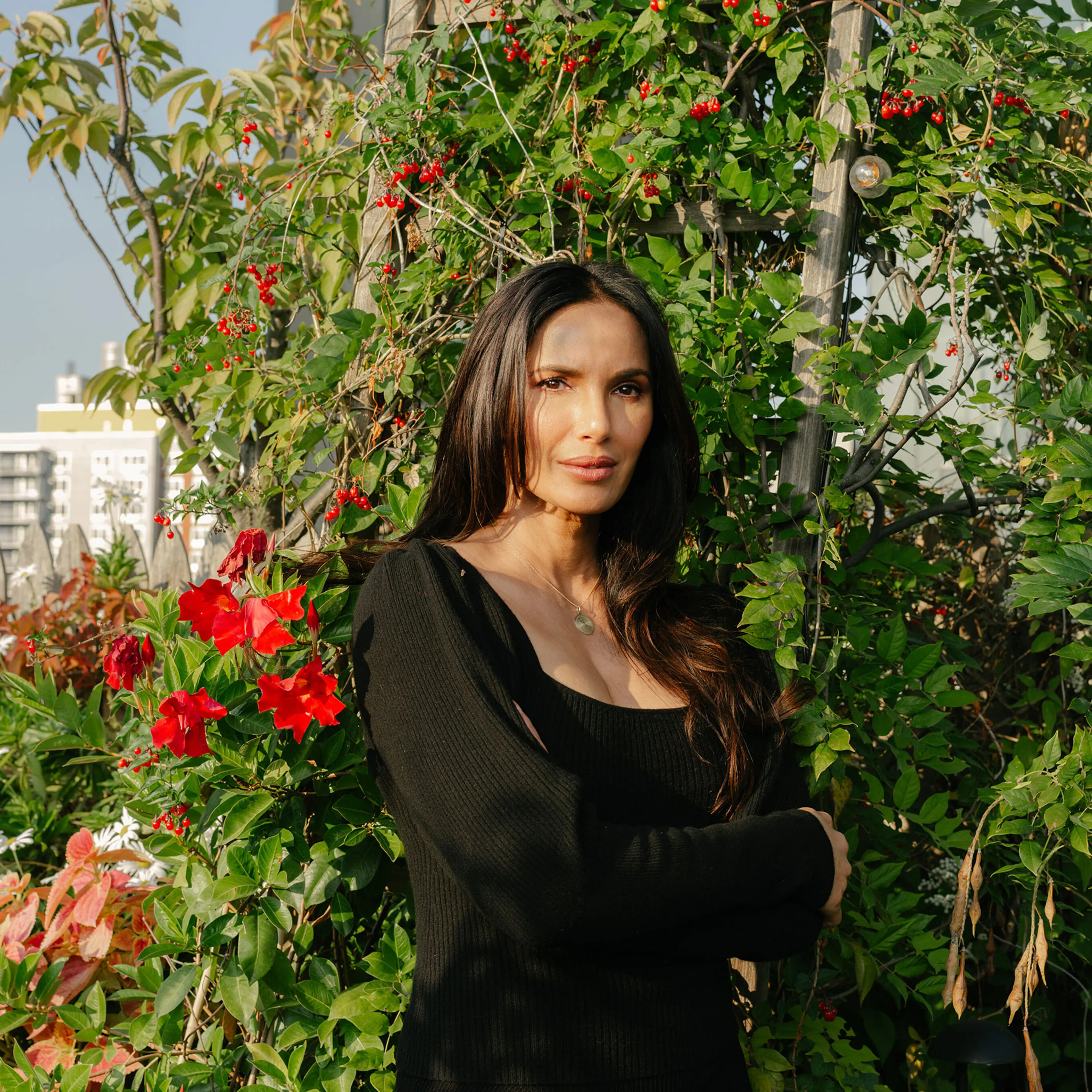 Padma Lakshmi, wearing a Tiffany gold necklace with a medallion of St. Christopher, in New York, Oct. 11, 2024. (Morgan Rachel Levy/The New York Times)