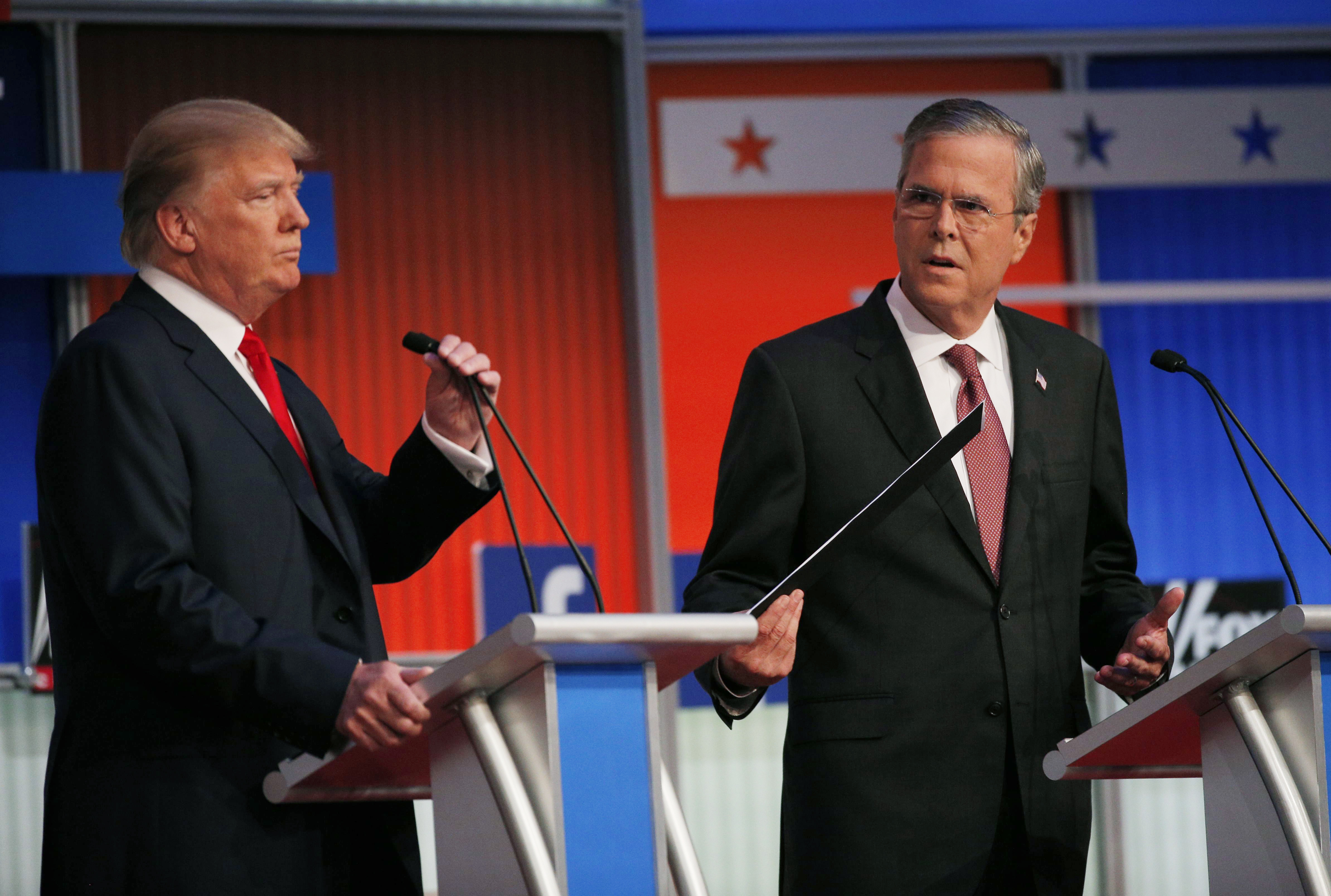 Republican 2016 presidential candidates Trump and Bush take their places at their podiums before the start of the first official Republican presidential candidates debate of the 2016 U.S. presidential campaign in Cleveland