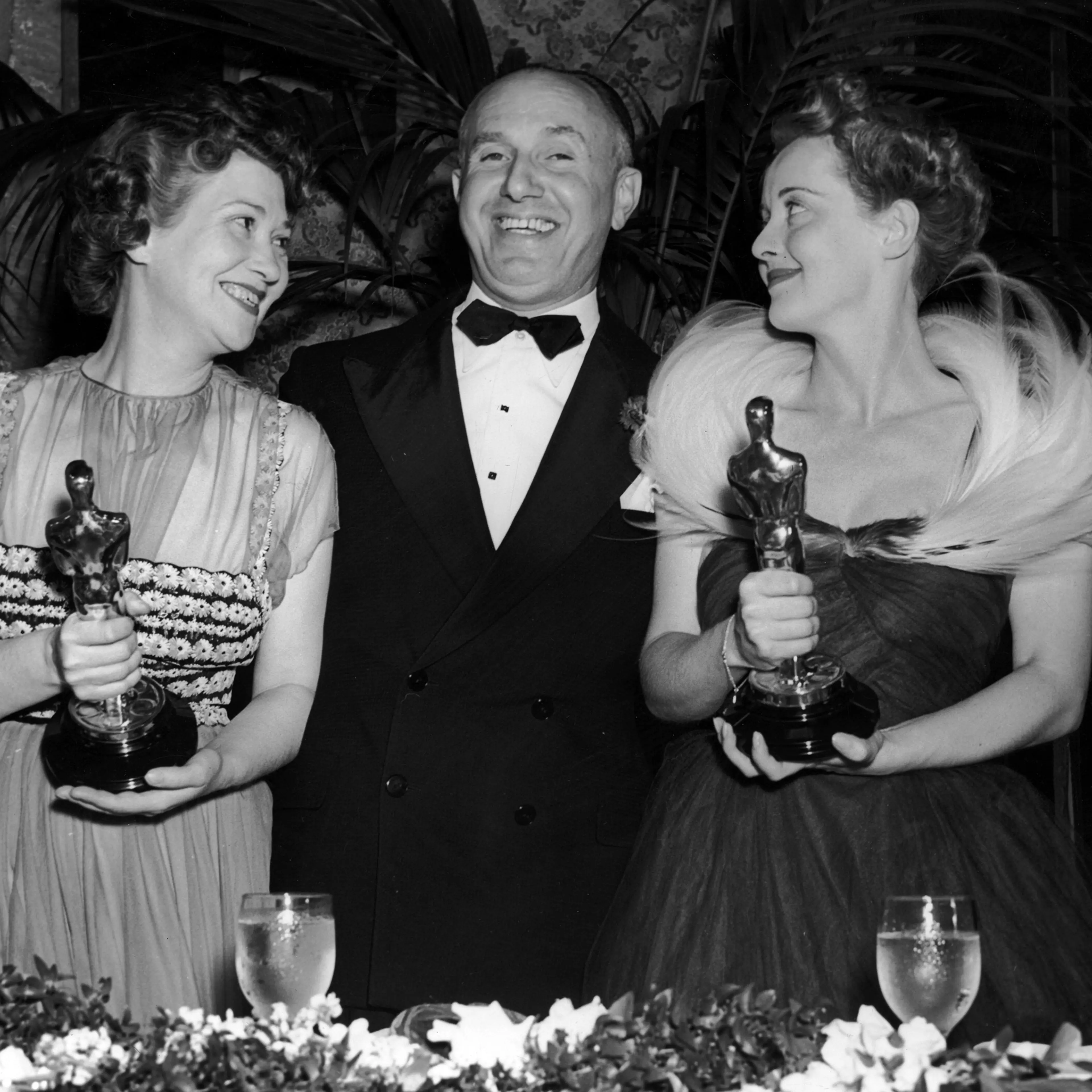 Jack Warner with Fay Bainter and Bette Davis who hold their Oscars at the Academy Awards, 1939.