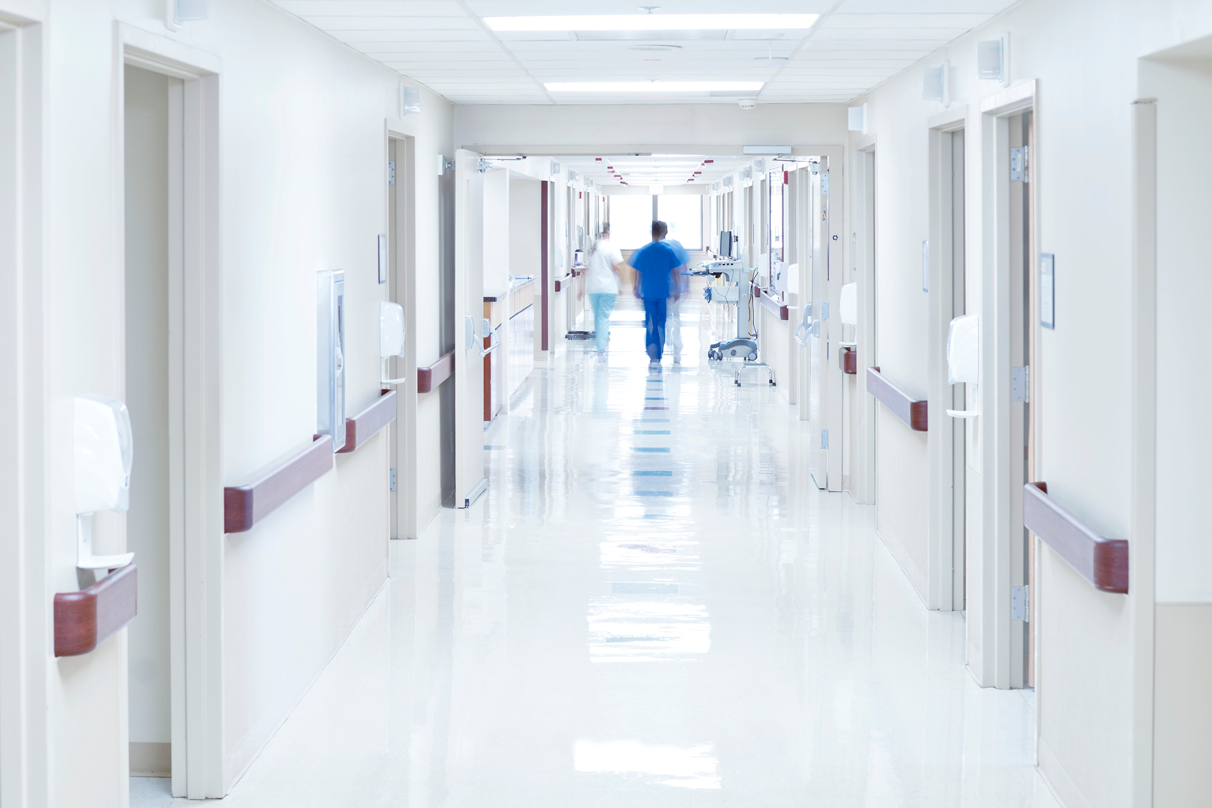 Doctor walking down hospital corridor