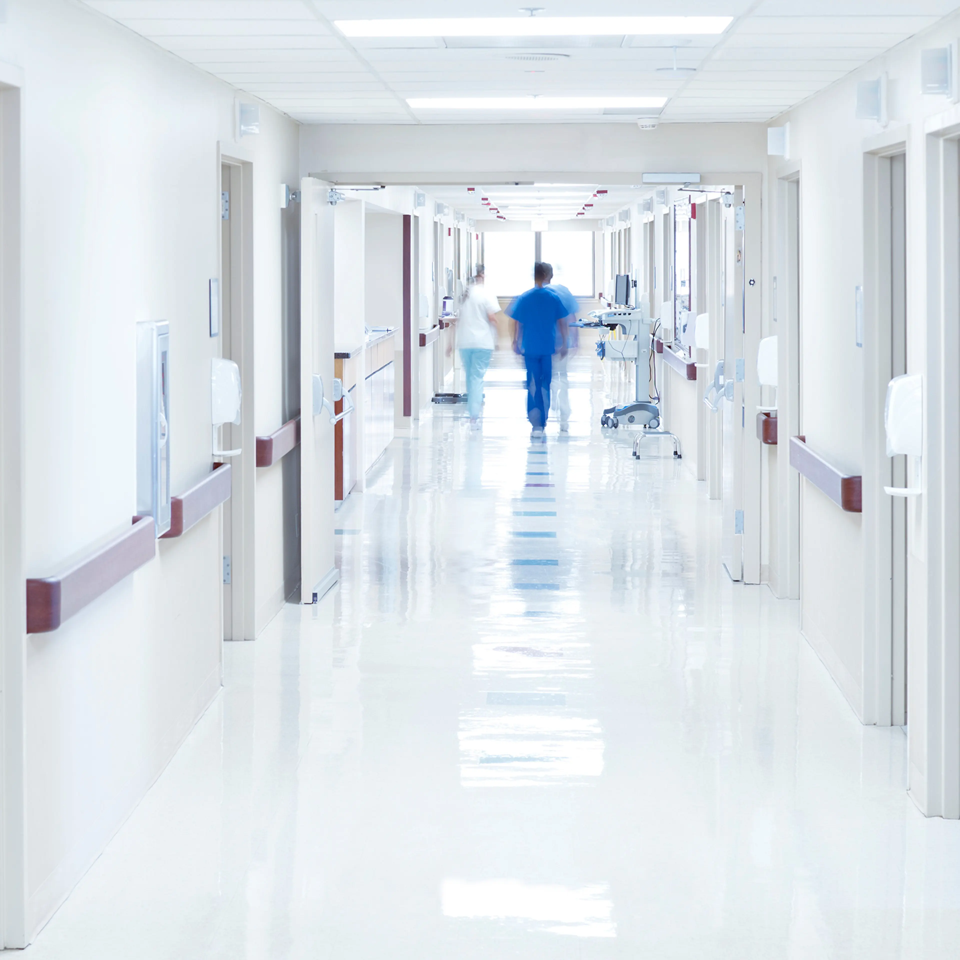 Doctor walking down hospital corridor