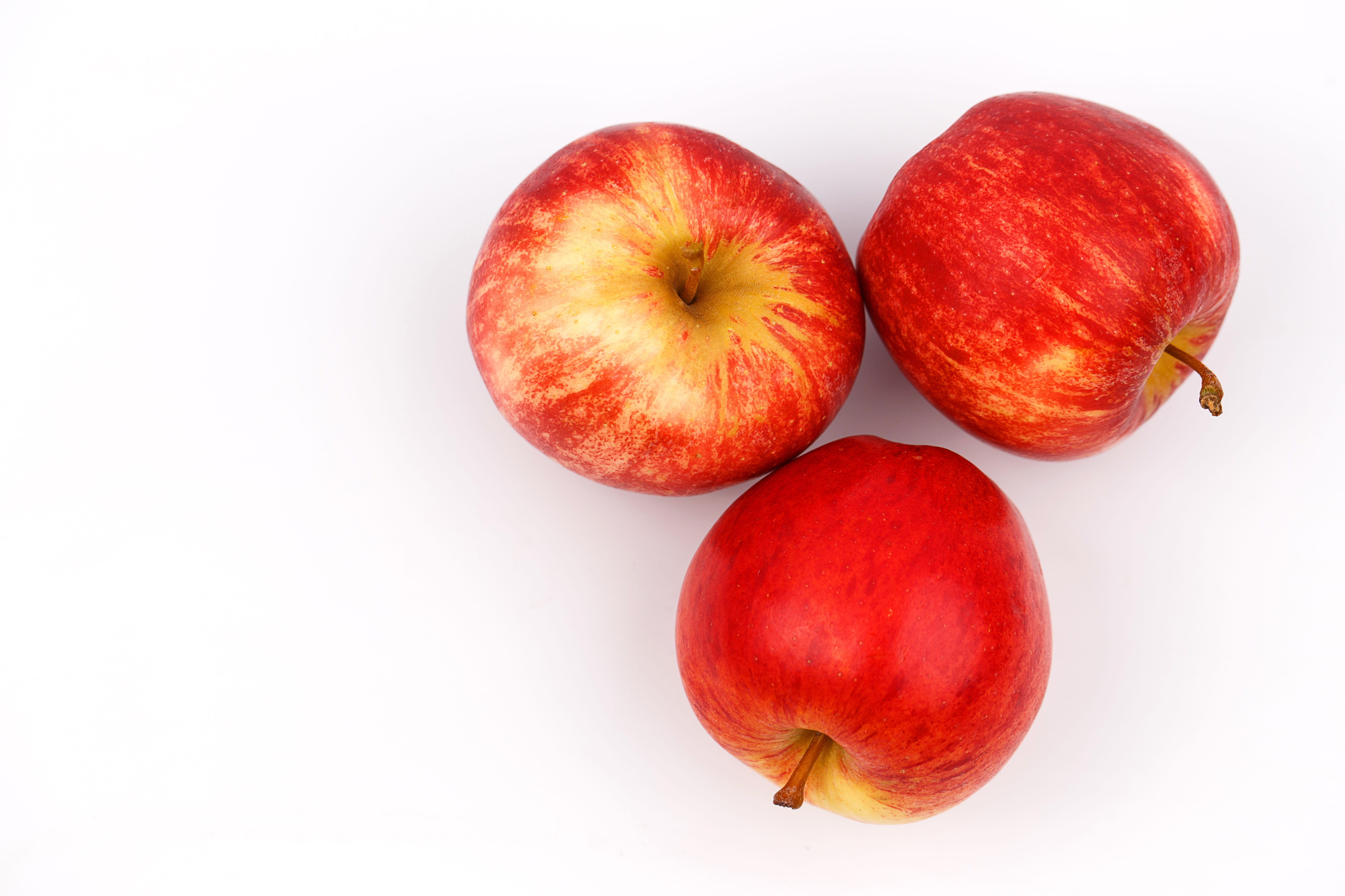 Directly Above Shot Of Apples Over White Background