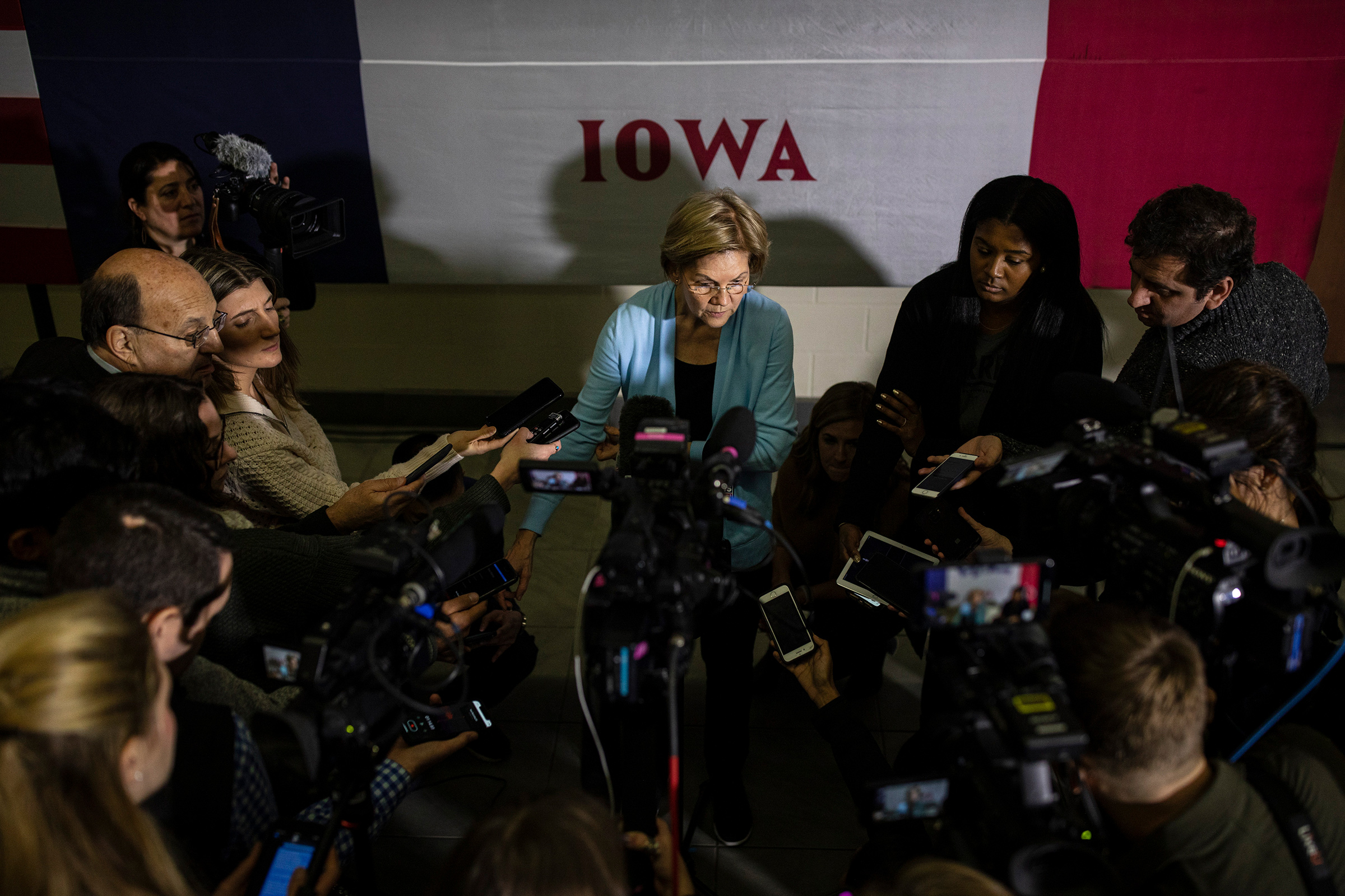 Senator Elizabeth Warren speaks in Mason City, Iowa, on Jan. 11; the impeachment trial is set to call her back to D.C.