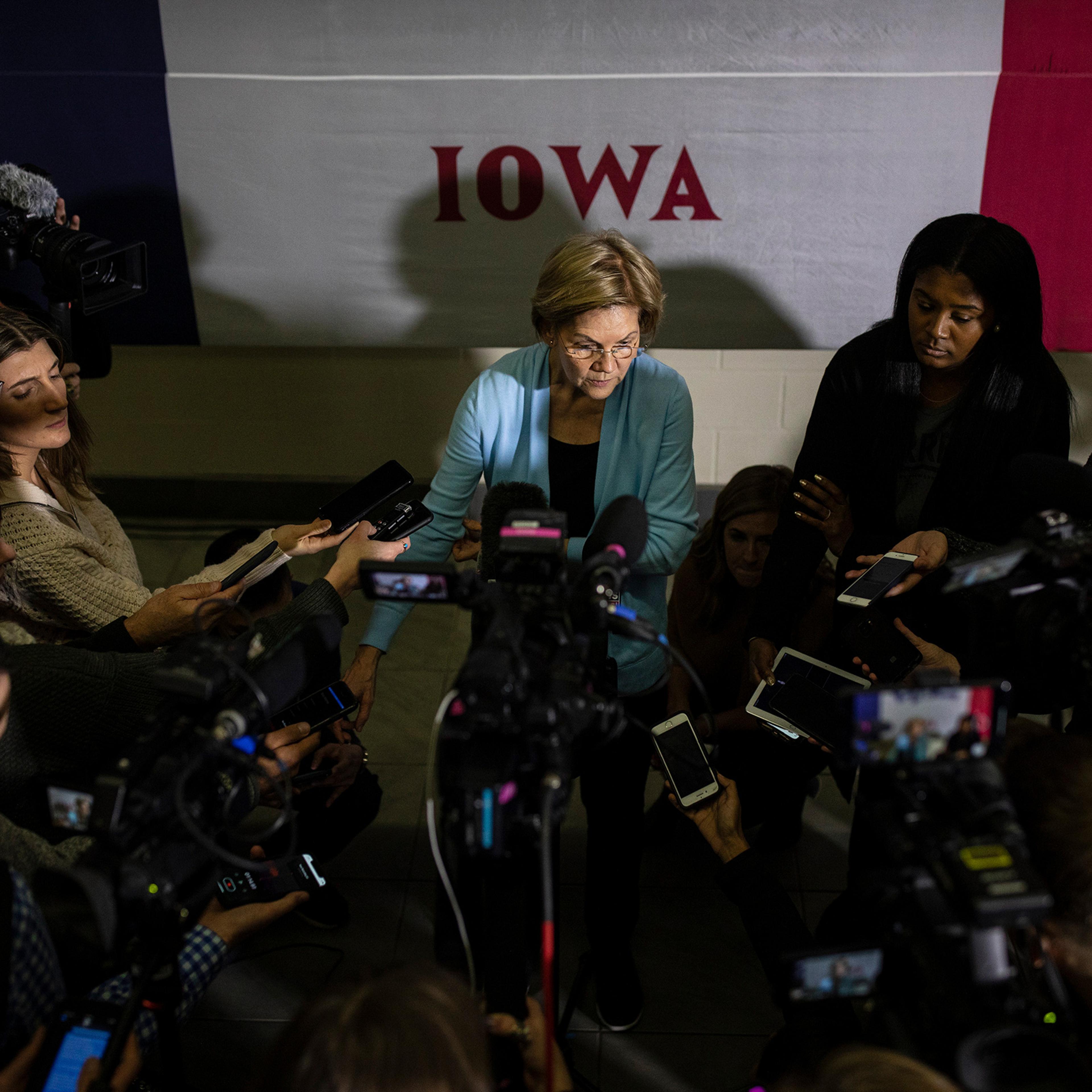 Senator Elizabeth Warren speaks in Mason City, Iowa, on Jan. 11; the impeachment trial is set to call her back to D.C.