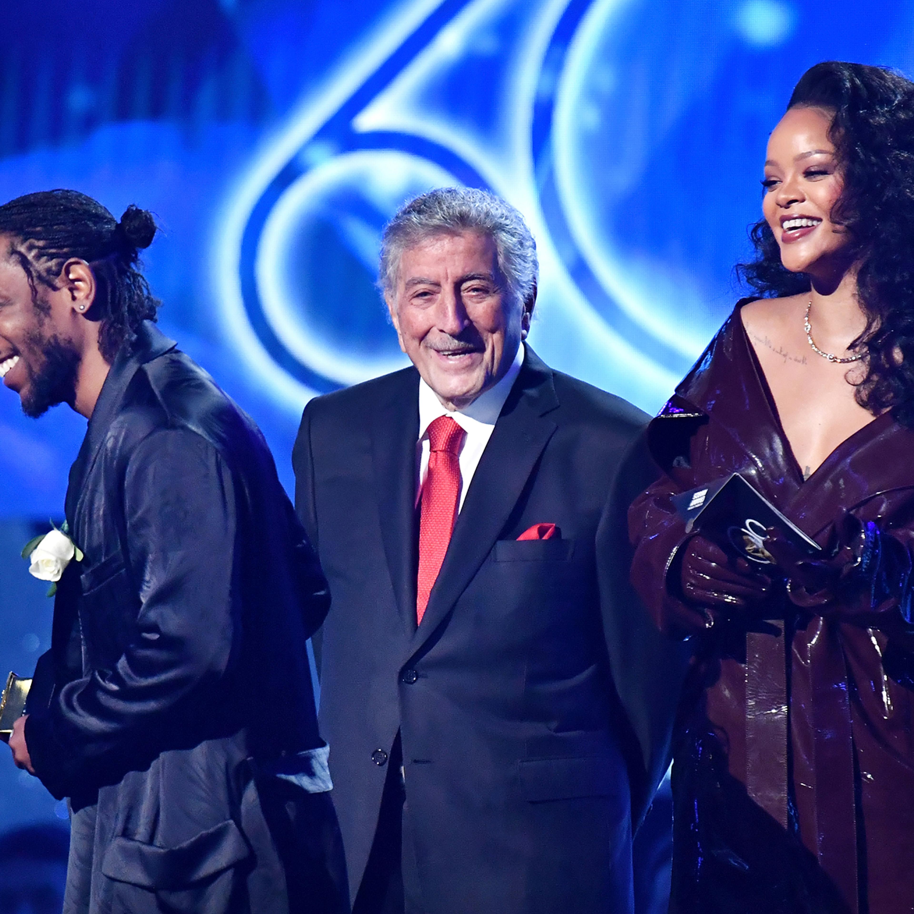 Recording artists Kendrick Lamar (L) and Rihanna (R) accept the award for Best Rap/Sung Performance from Tony Bennett onstage during the 60th Annual GRAMMY Awards at Madison Square Garden on January 28, 2018 in New York City.