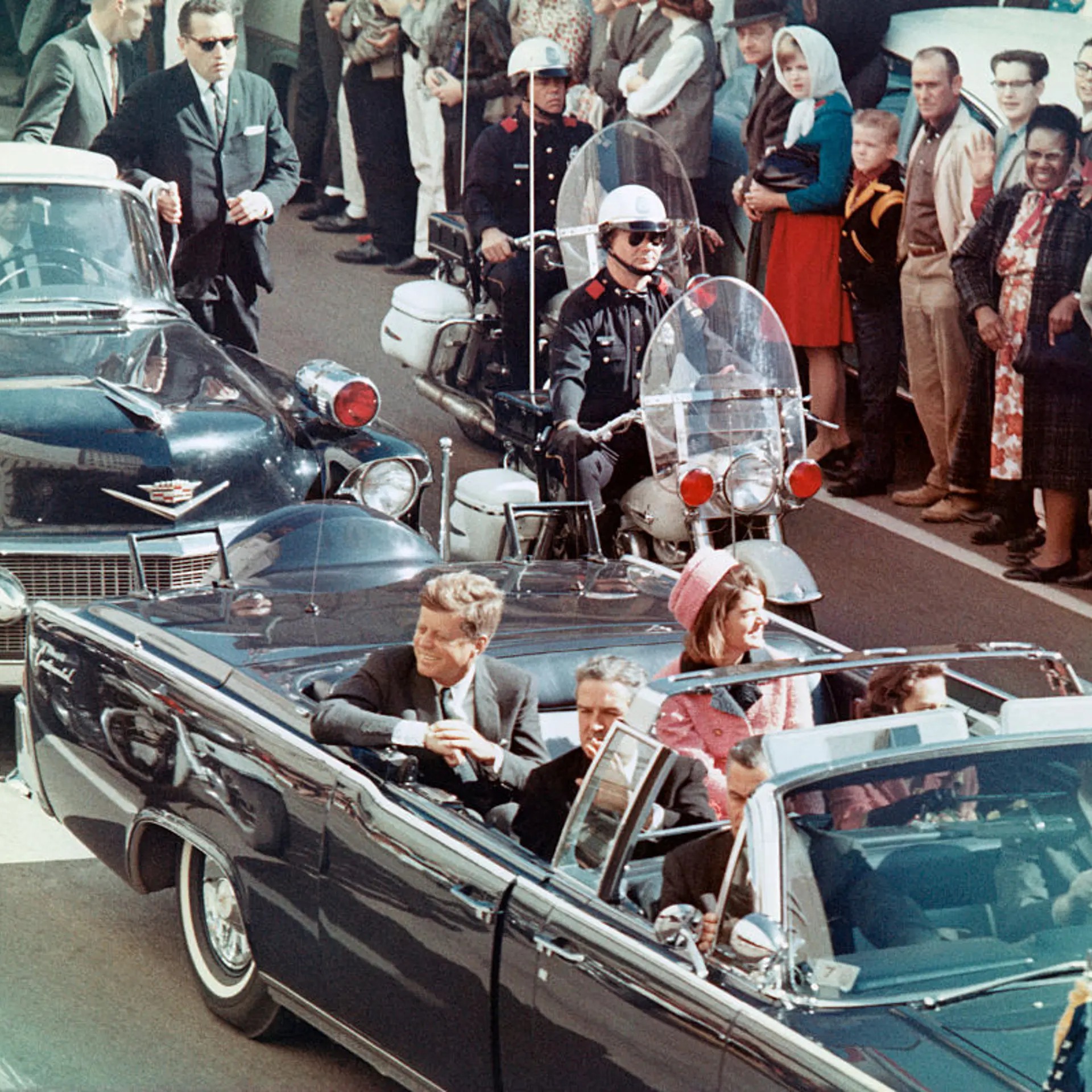 JFK and Jackie Kennedy riding in Dallas motorcade just before the assassination