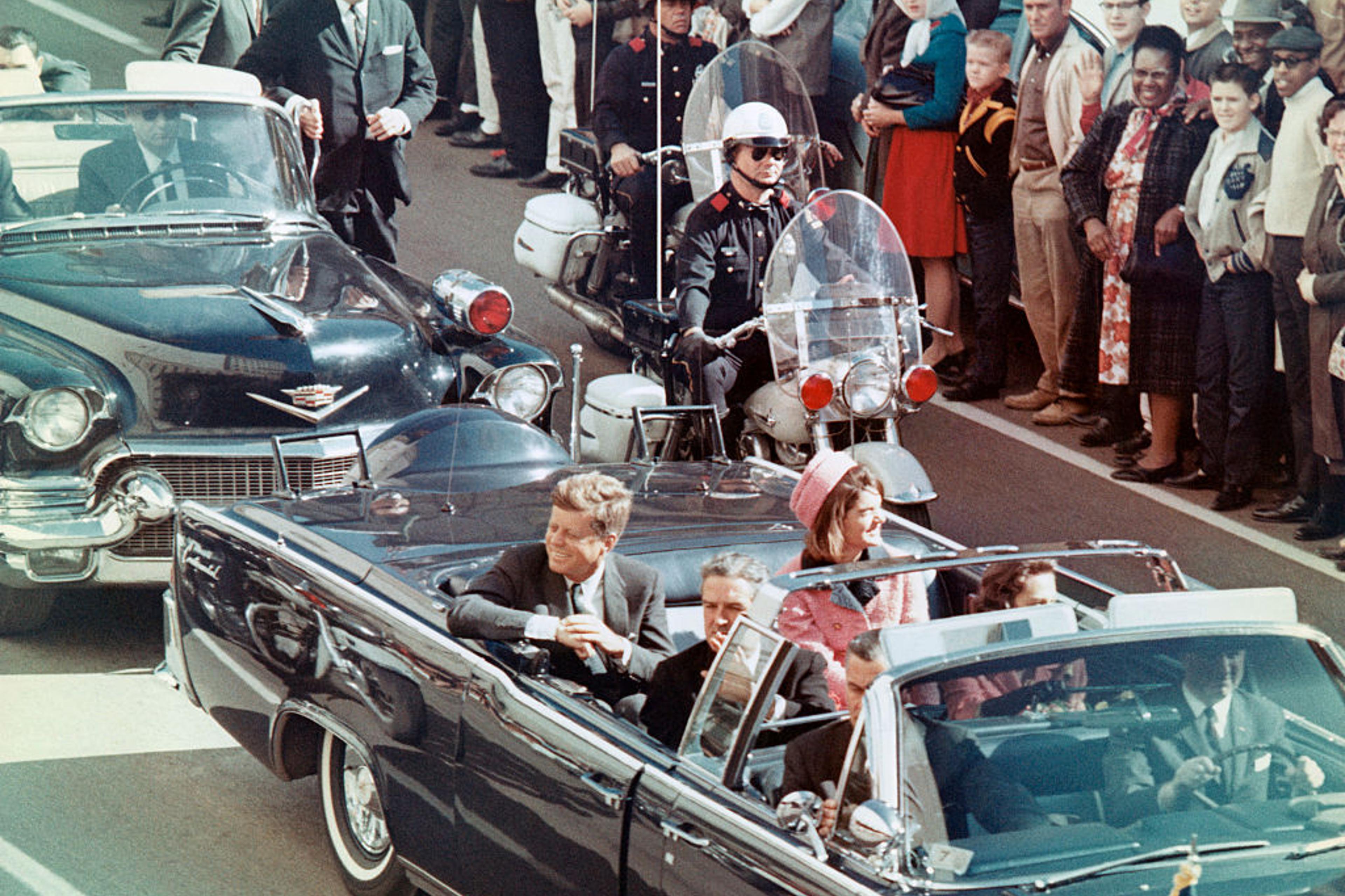 JFK and Jackie Kennedy riding in Dallas motorcade just before the assassination