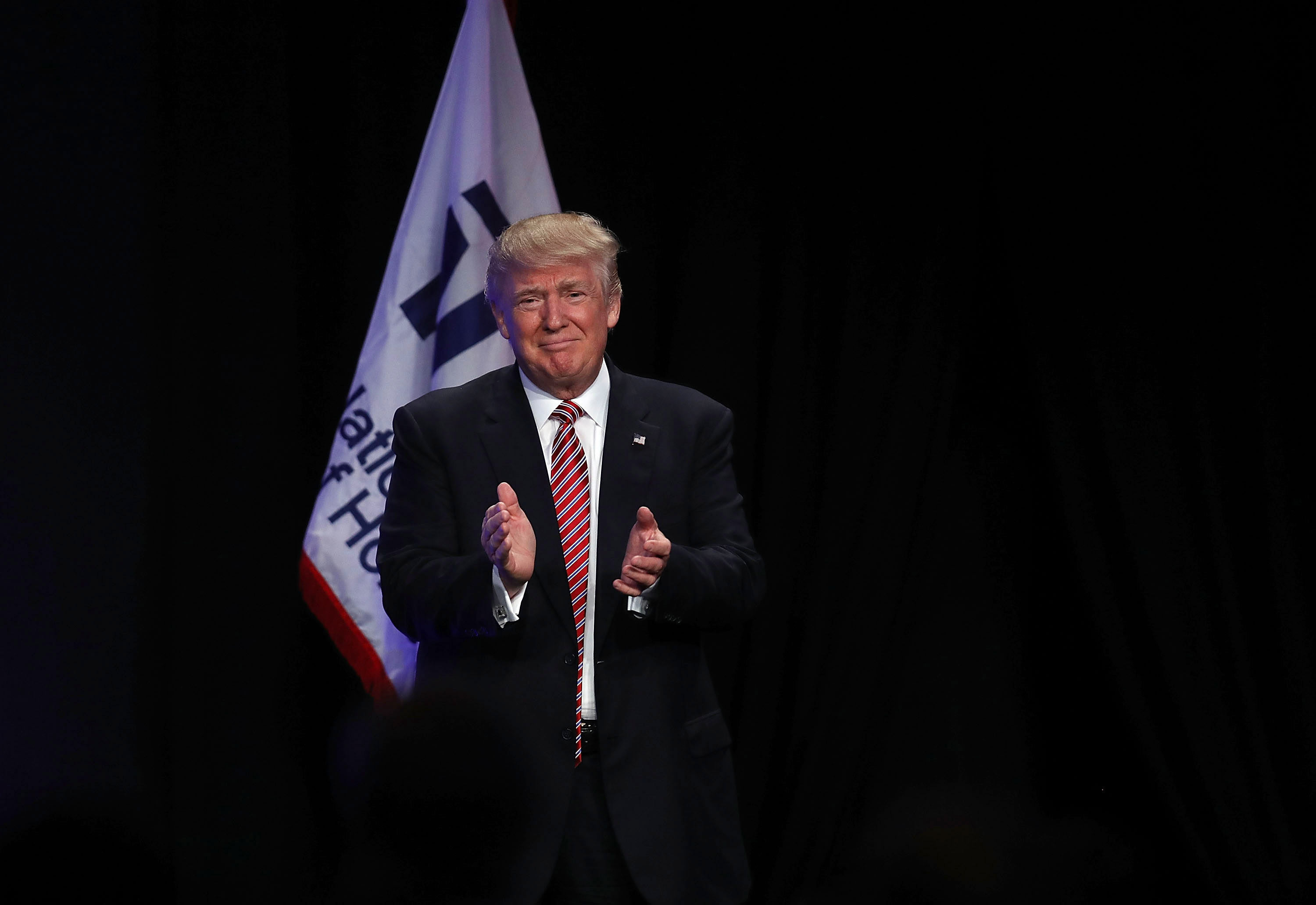 Republican presidential nominee Donald Trump is introduced to speak during an address to the National Association of Home Builders at the Fontainebleau Miami Beach hotel on August 11, 2016 in Miami Beach, Florida.