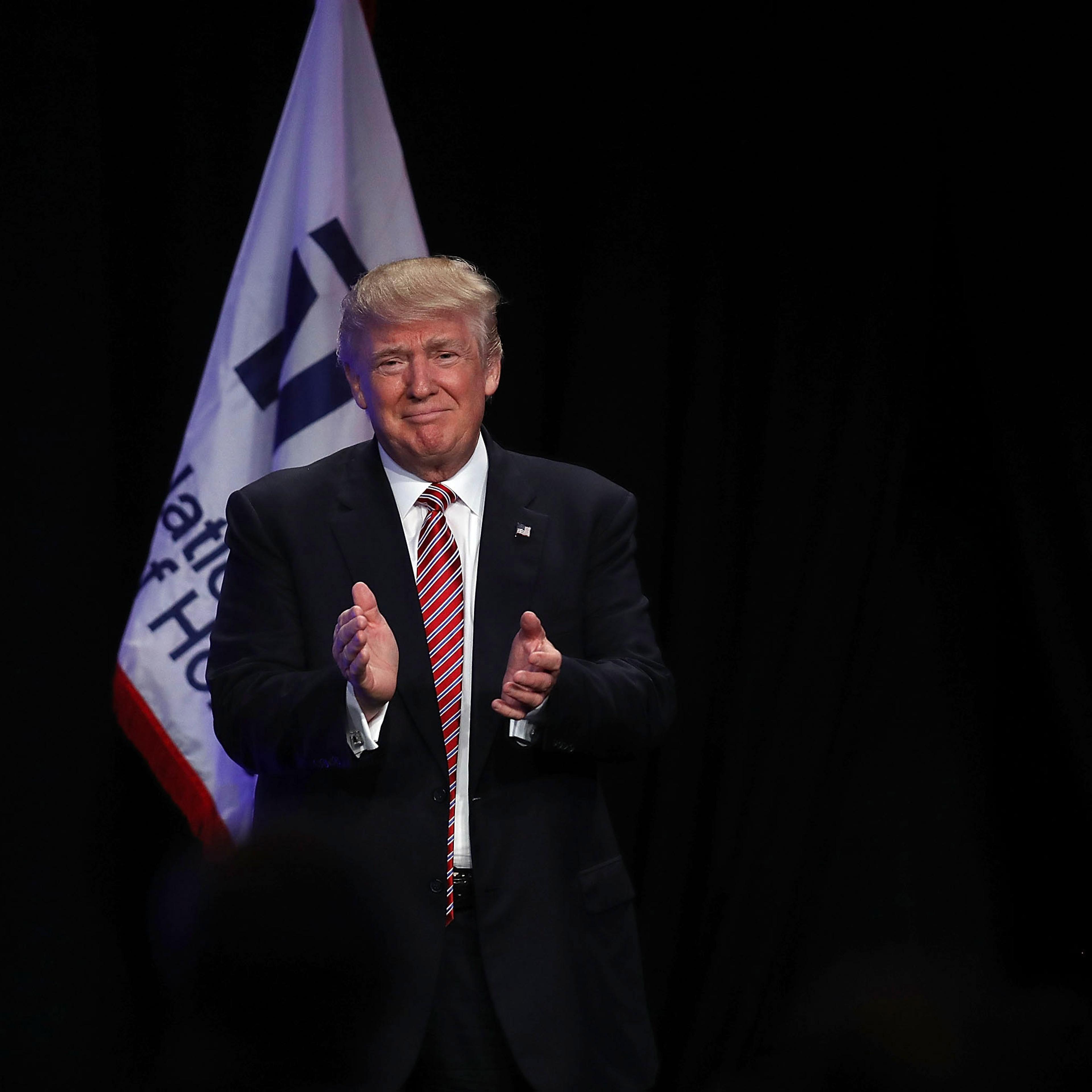 Republican presidential nominee Donald Trump is introduced to speak during an address to the National Association of Home Builders at the Fontainebleau Miami Beach hotel on August 11, 2016 in Miami Beach, Florida.