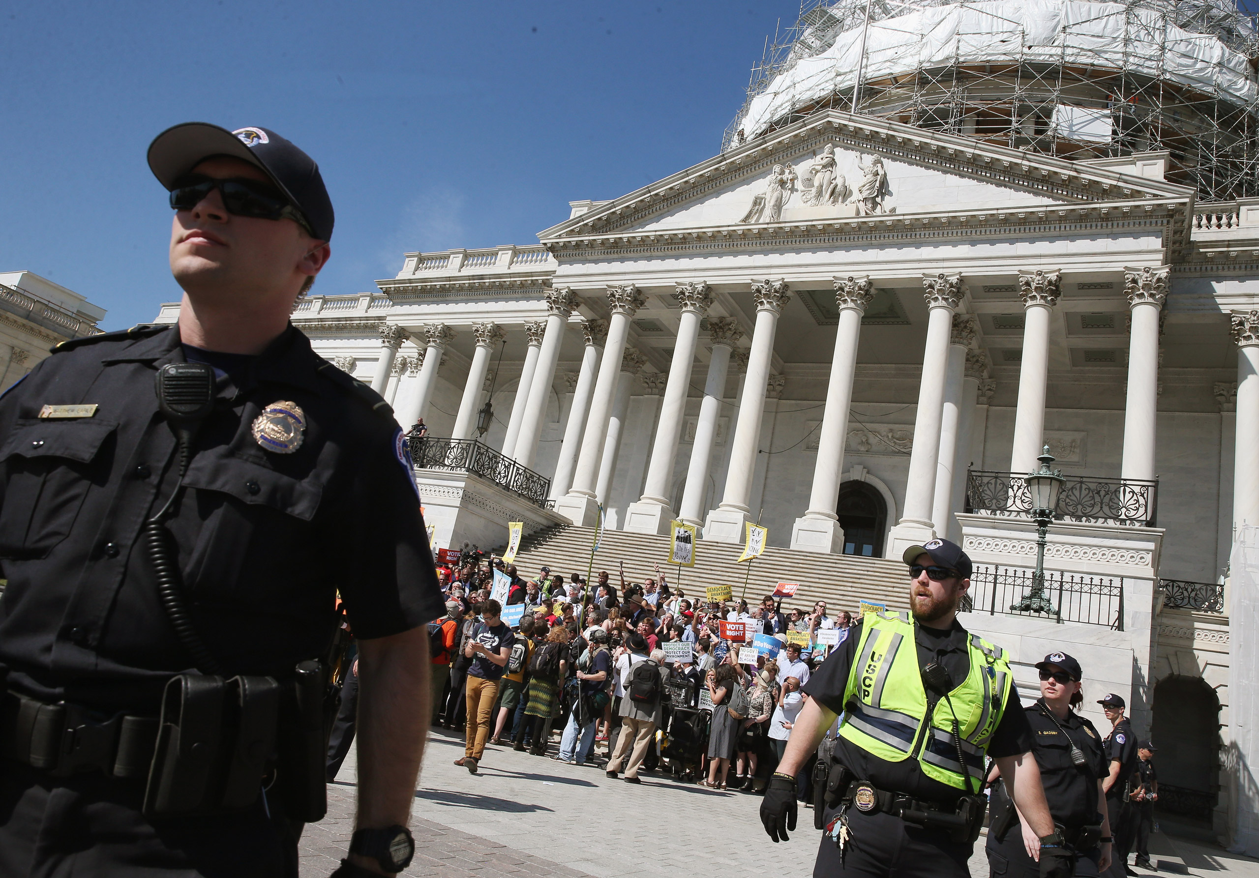 WASHINGTON, DC - APRIL 18: US Capitol Police give protesters a warning to move away from the front of the Capitol or get arrested, April 18, 2016 in Washington, DC. Protest groups Public Citizen and People for the American Way have been protesting the in