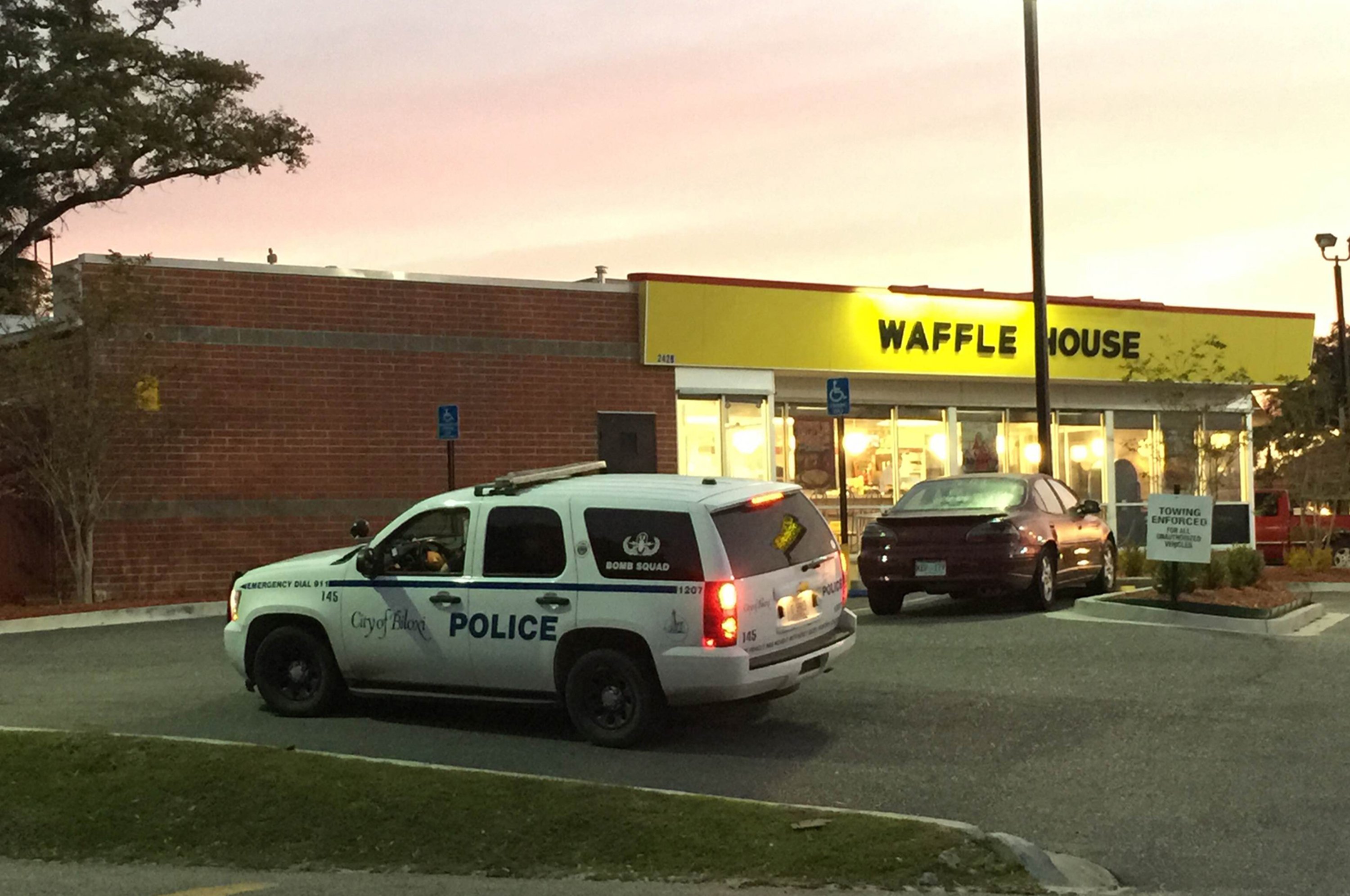 A police vehicle sits outside the Waffle House on U.S. 90 in Biloxi, Miss., after a fatal shooting on Nov. 27, 2015.