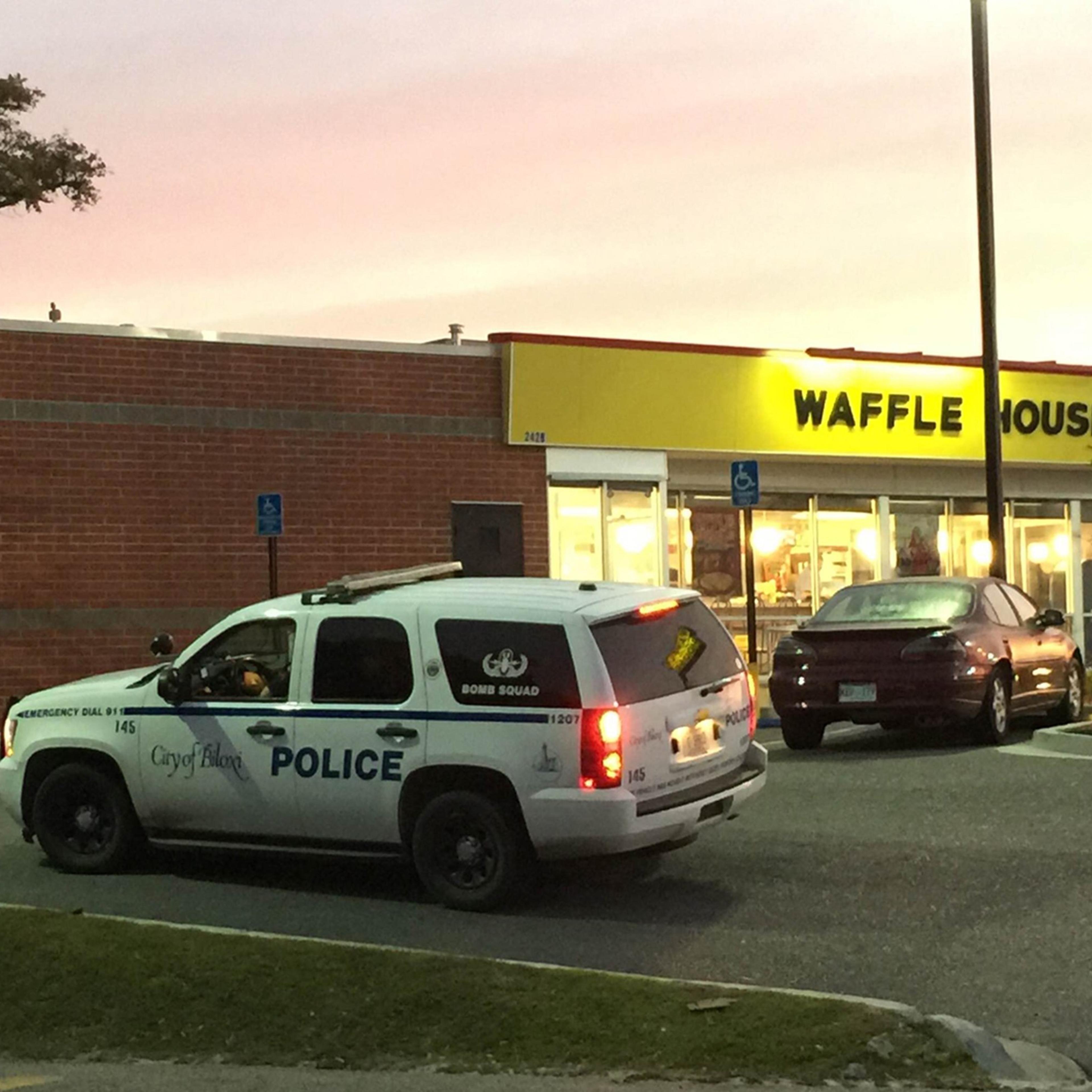 A police vehicle sits outside the Waffle House on U.S. 90 in Biloxi, Miss., after a fatal shooting on Nov. 27, 2015.