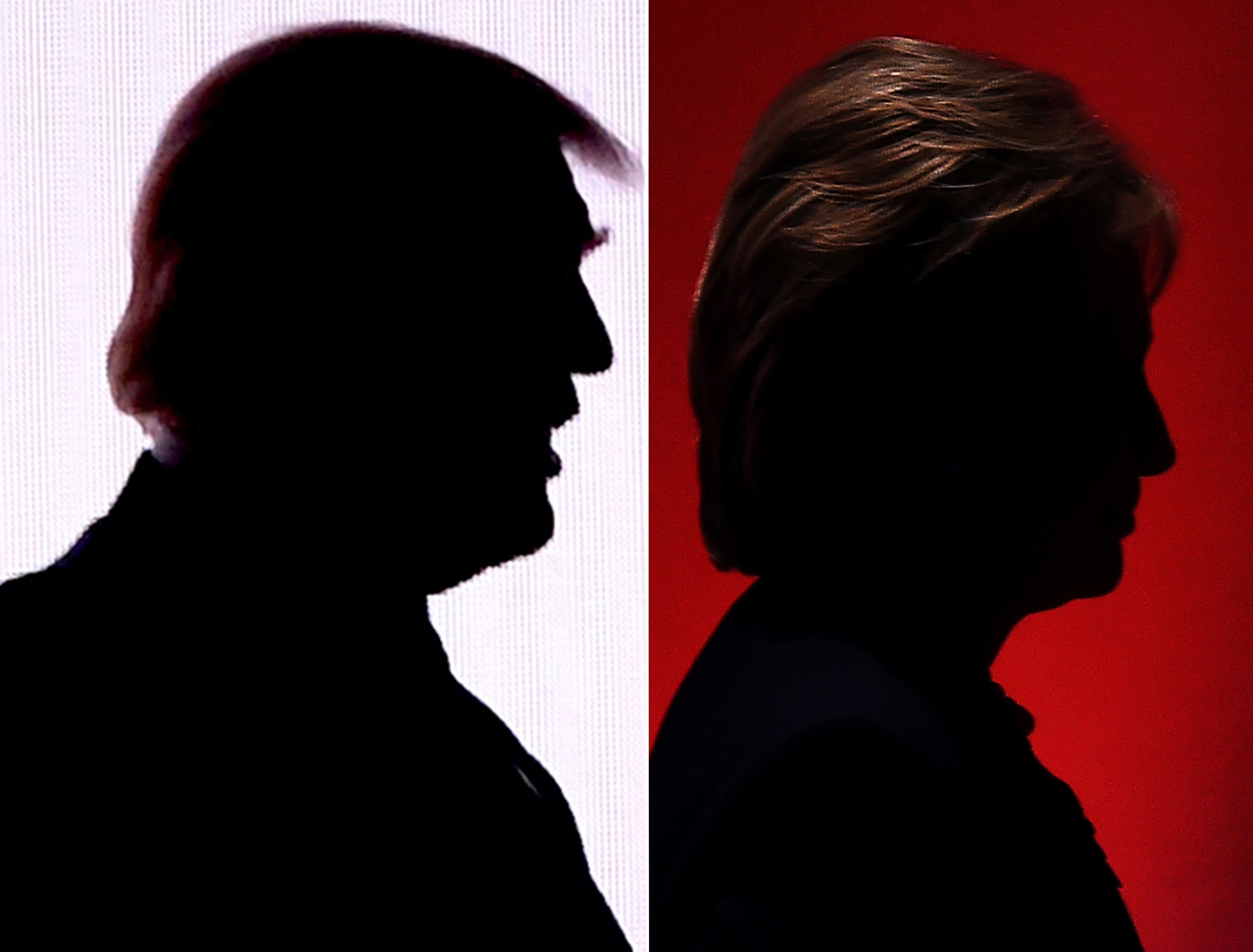 This combination of file photos shows the silhouettes of Republican presidential nominee Donald Trump(R) July 18, 2016 and Democratic presidential nominee Hillary Clinton on February 4, 2016.
