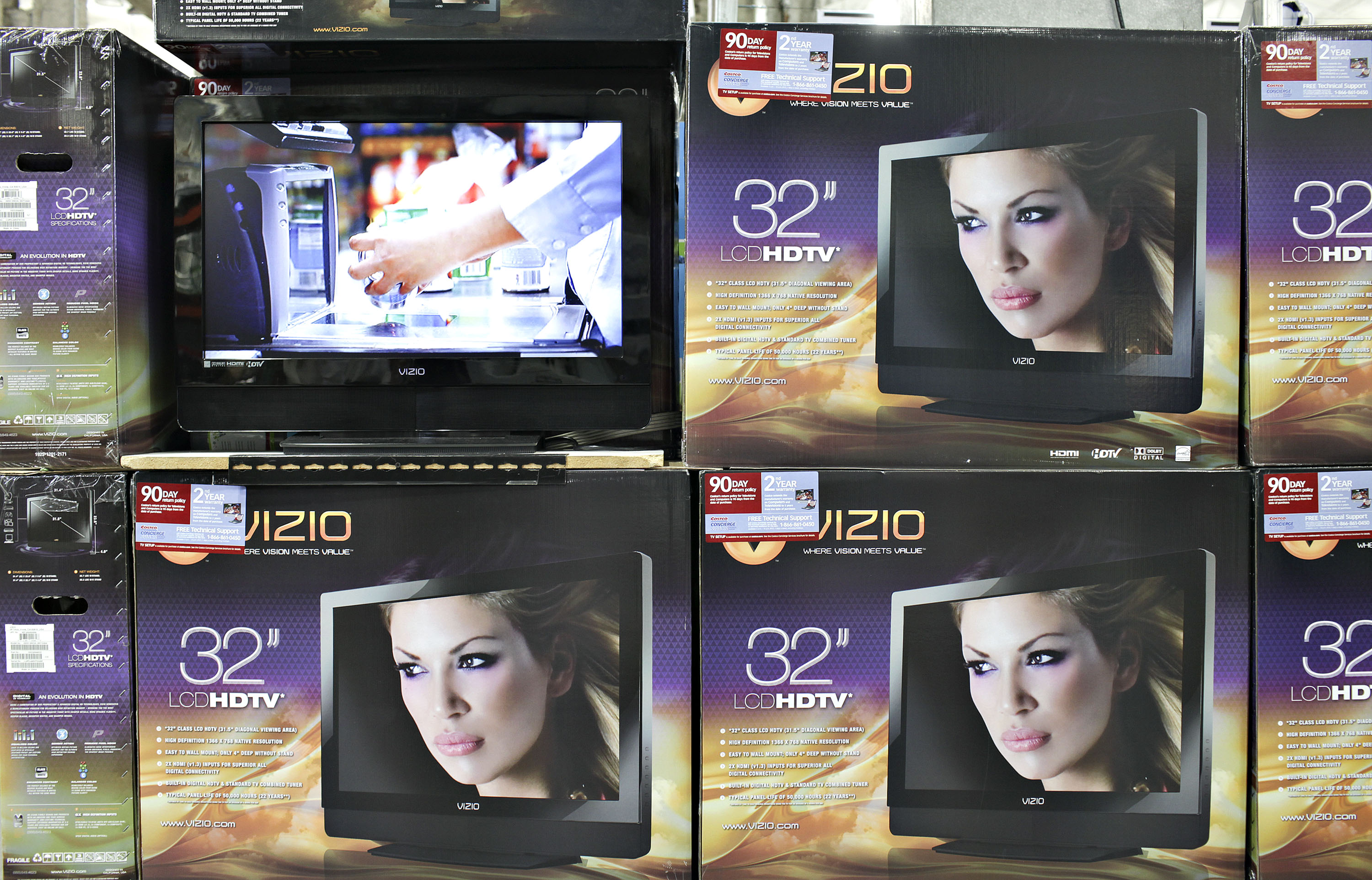 ViZio flat screen televisions sit on display inside a Costco
