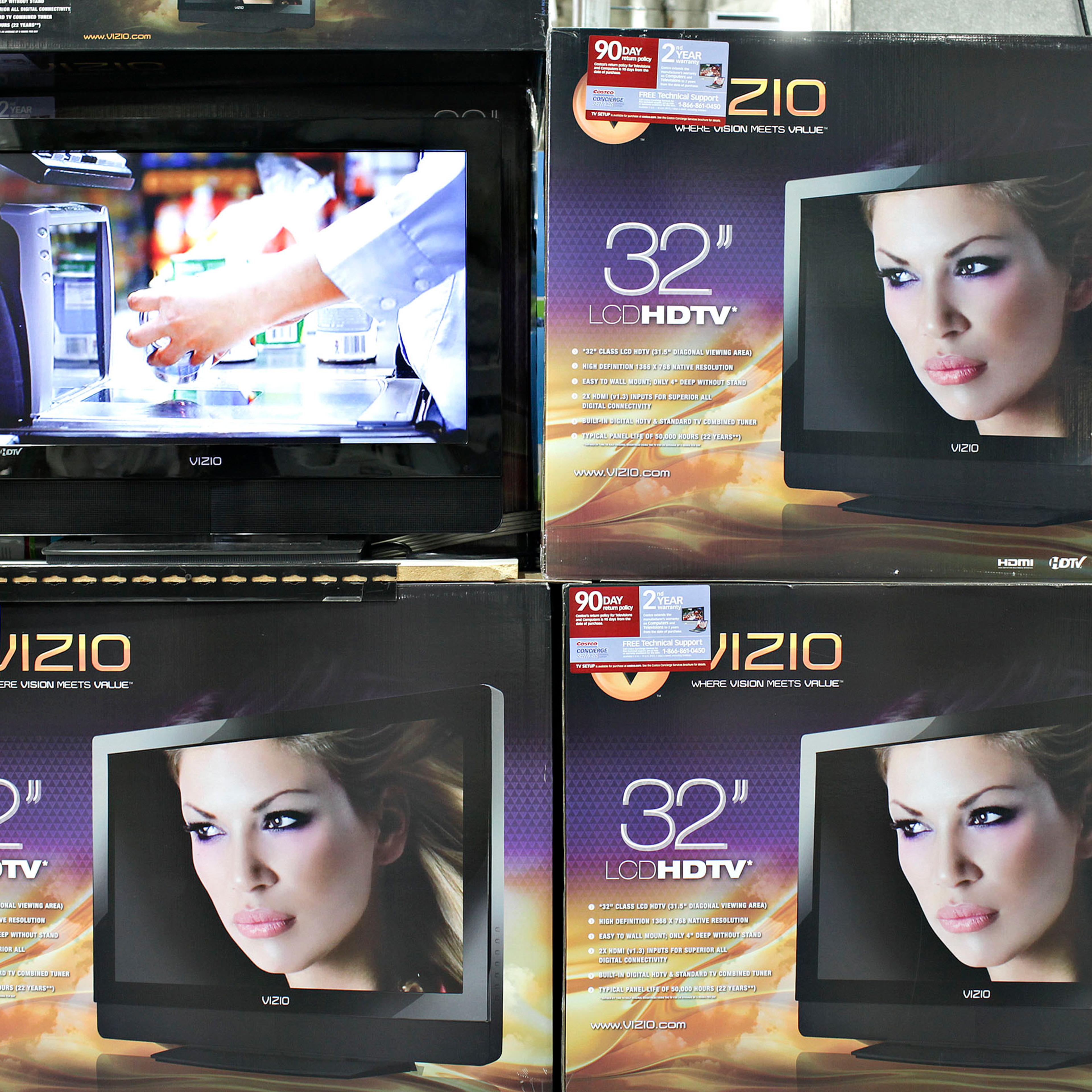 ViZio flat screen televisions sit on display inside a Costco
