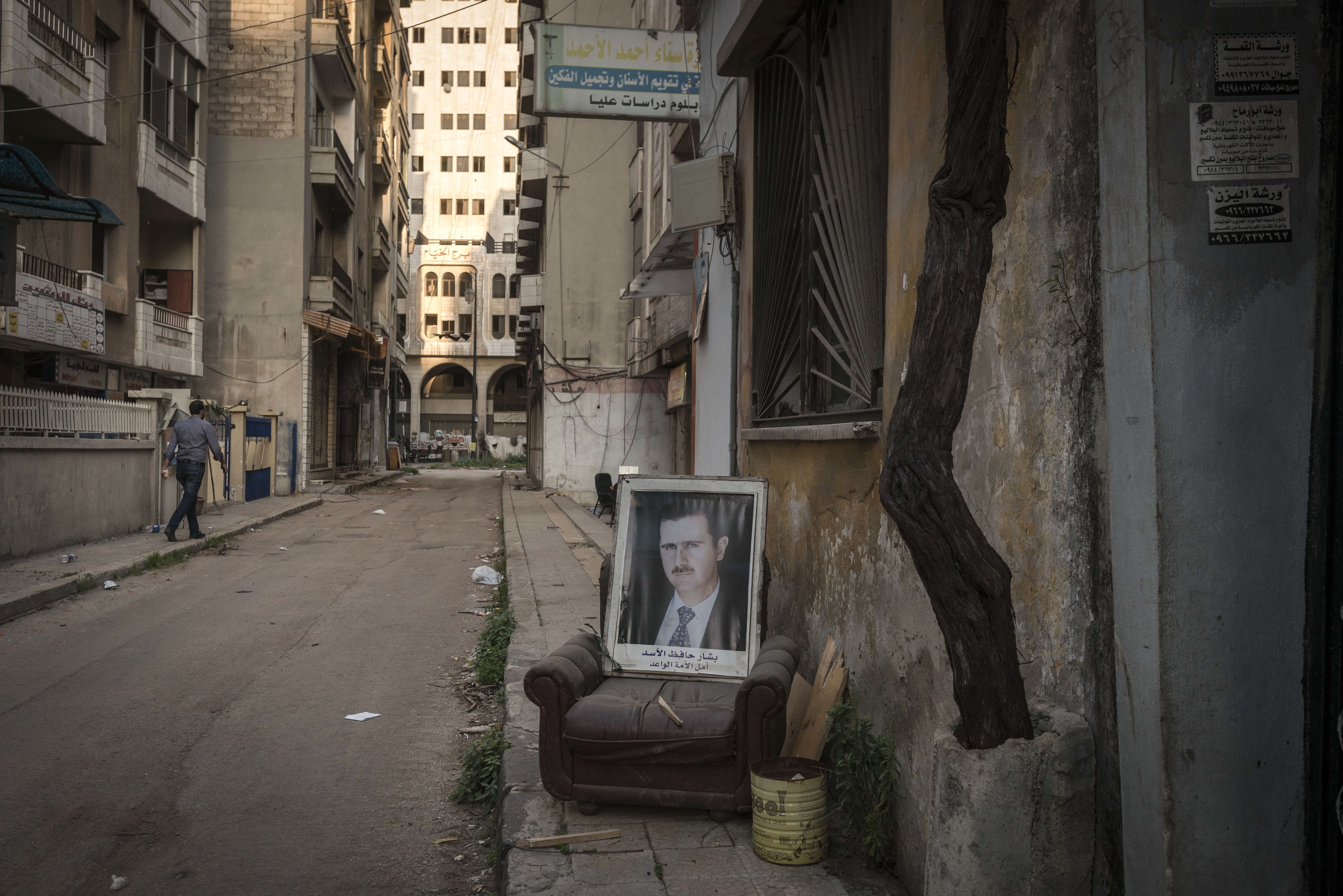 A portrait of President Assad on a street in Homs, Syria, March 23, 2014.