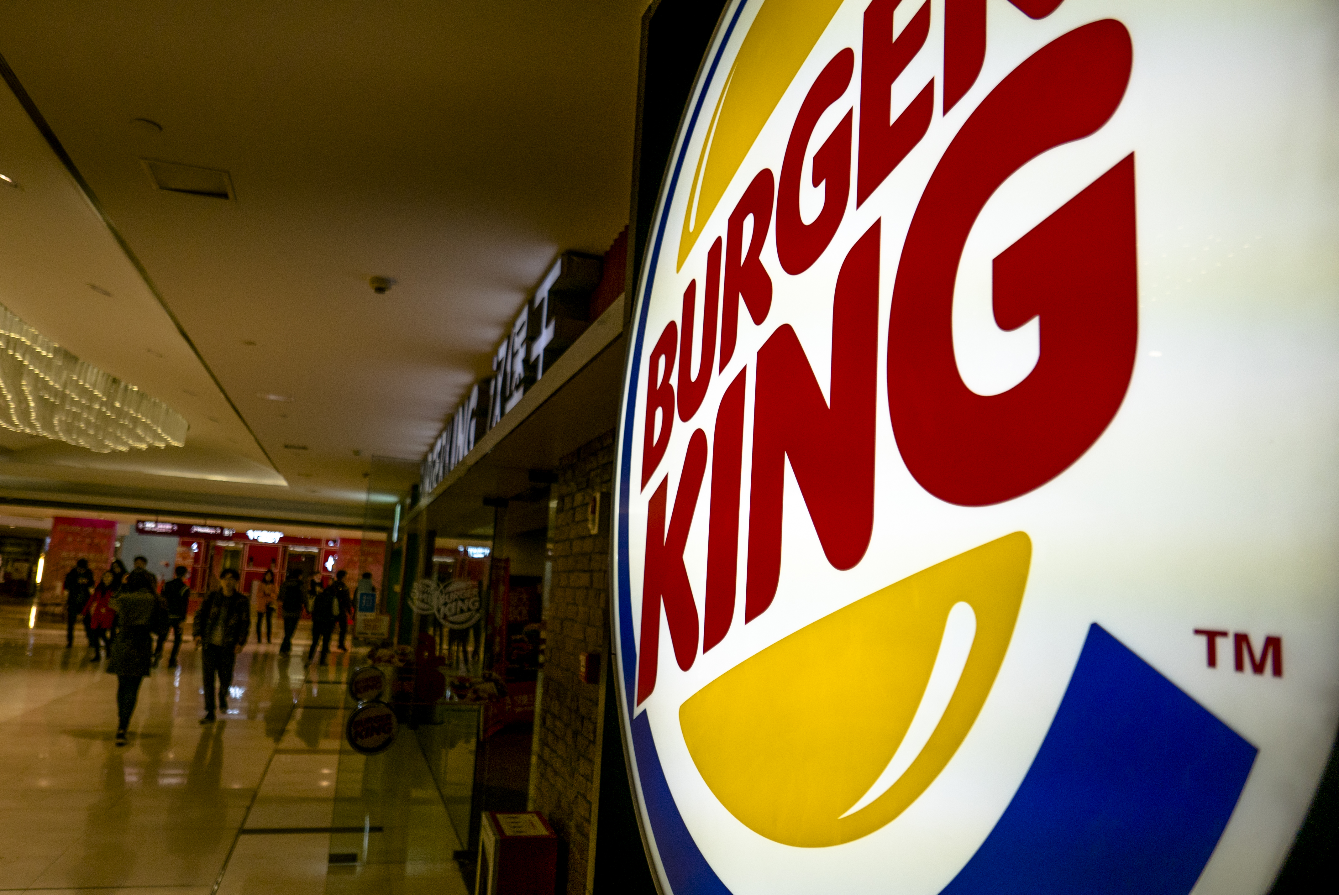 Lightbox logo of Burger King in a shopping mall.  While