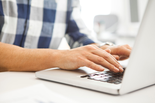 man-typing-laptop