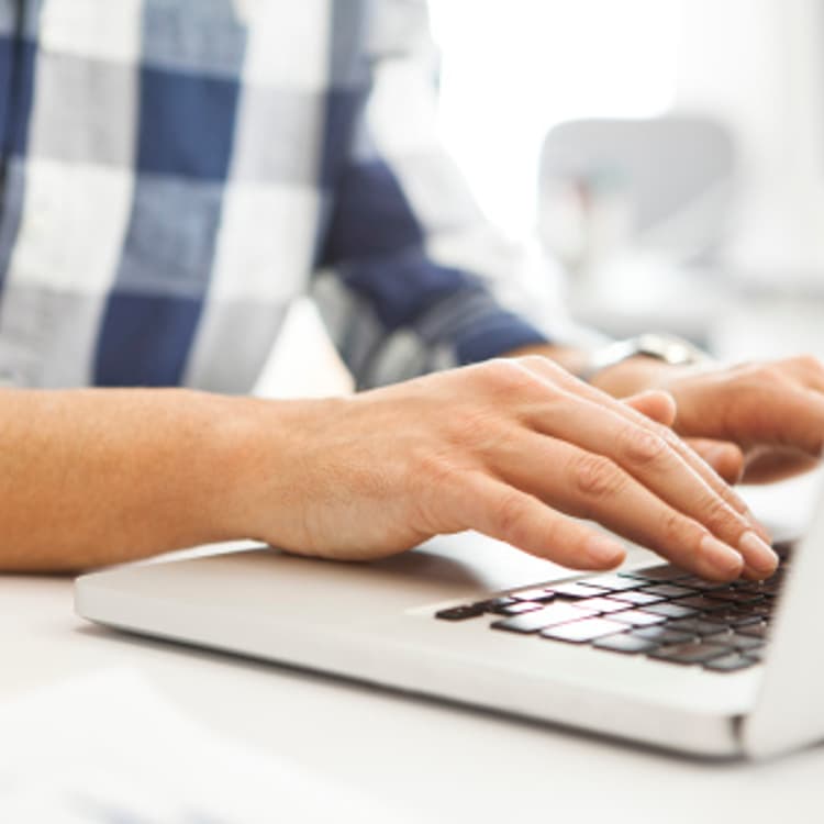 man-typing-laptop