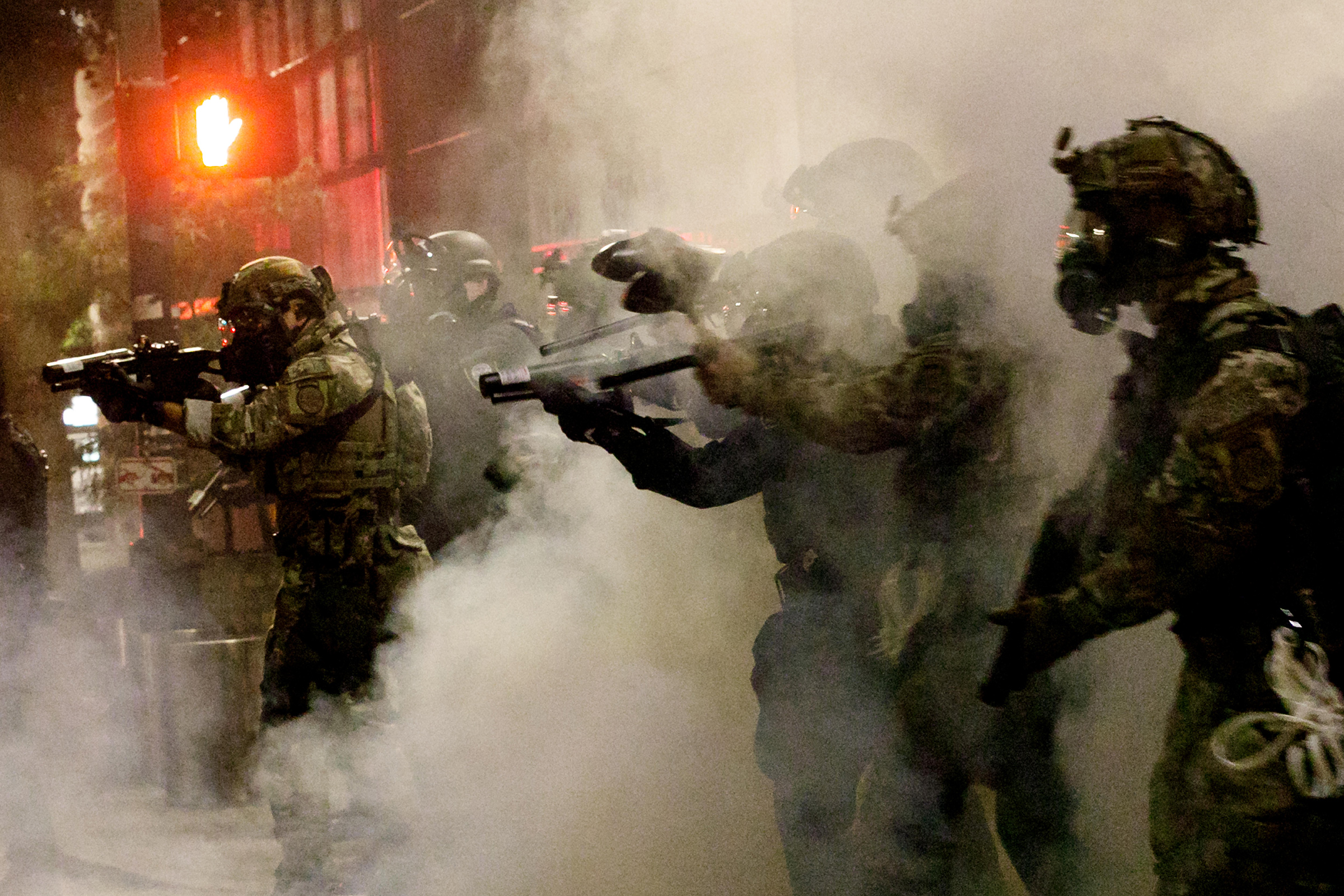 Federal officers open fire on demonstrators with 'less-lethal' weapons on July 16 at Portland Federal Courthouse