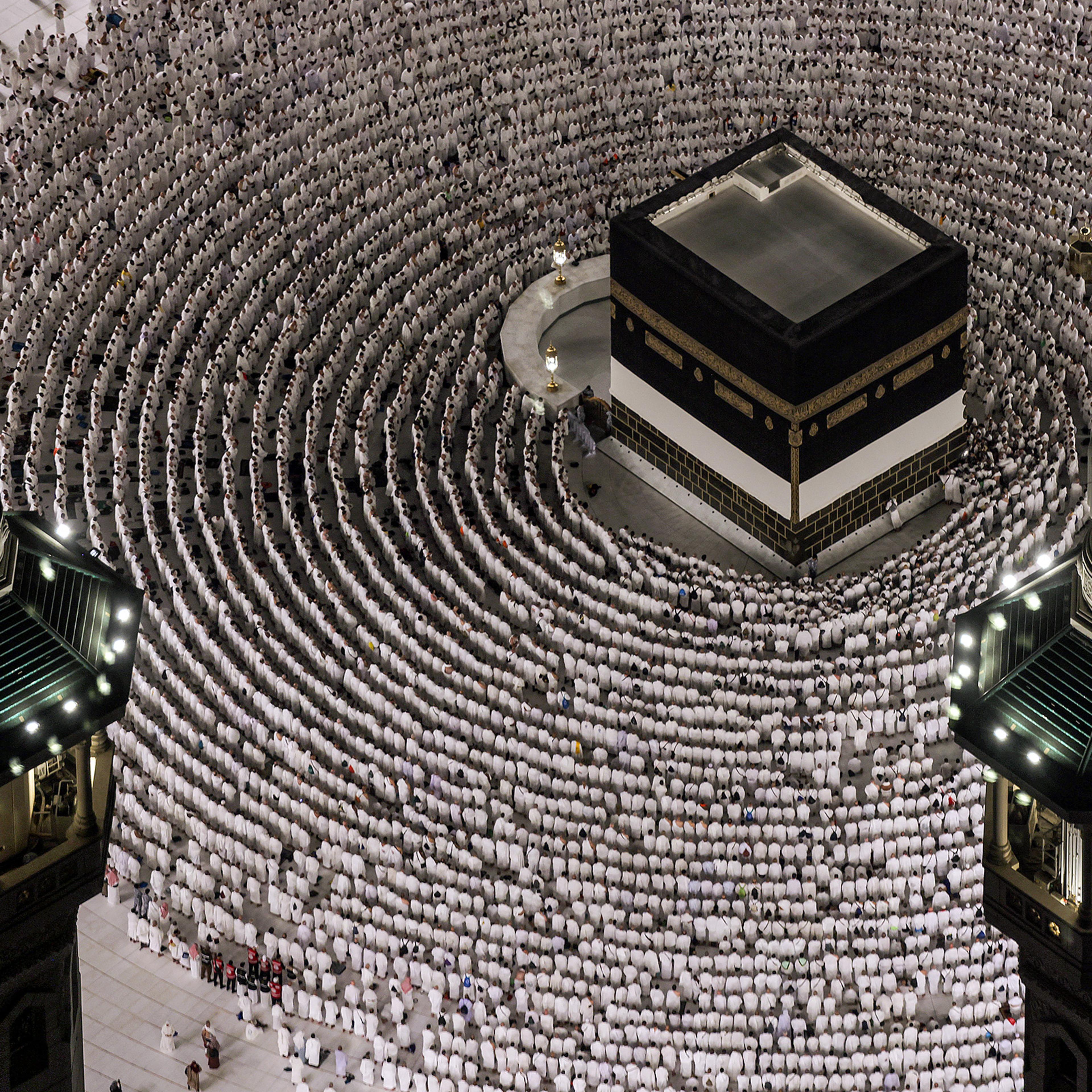 Muslim worshippers gather to pray around the Ka'ba, Islam's holiest shrine, at the Grand Mosque complex ahead of the annual Hajj pilgrimage in the holy city of Mecca on June 1, 2025.