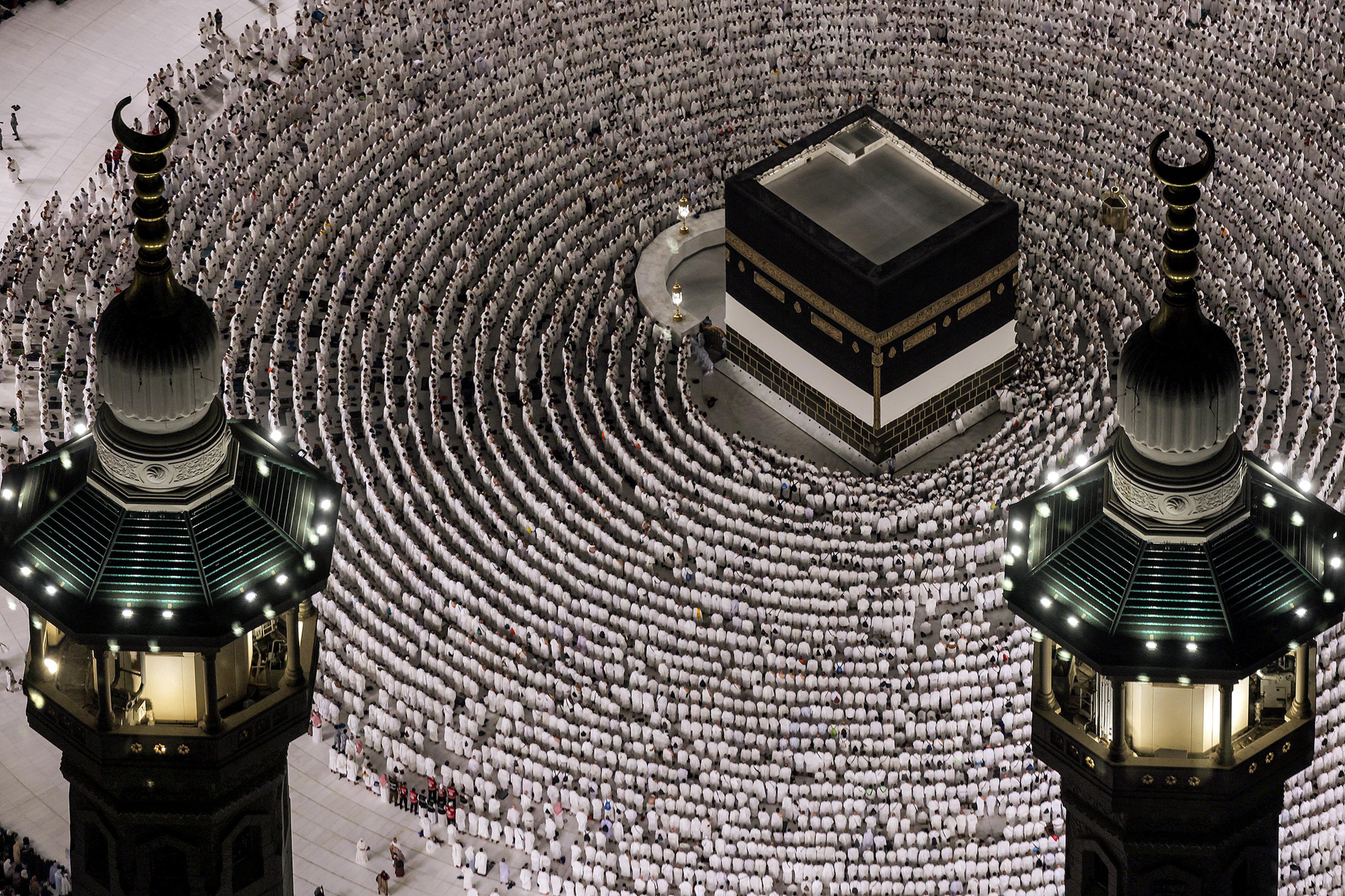 Muslim worshippers gather to pray around the Ka'ba, Islam's holiest shrine, at the Grand Mosque complex ahead of the annual Hajj pilgrimage in the holy city of Mecca on June 1, 2025.