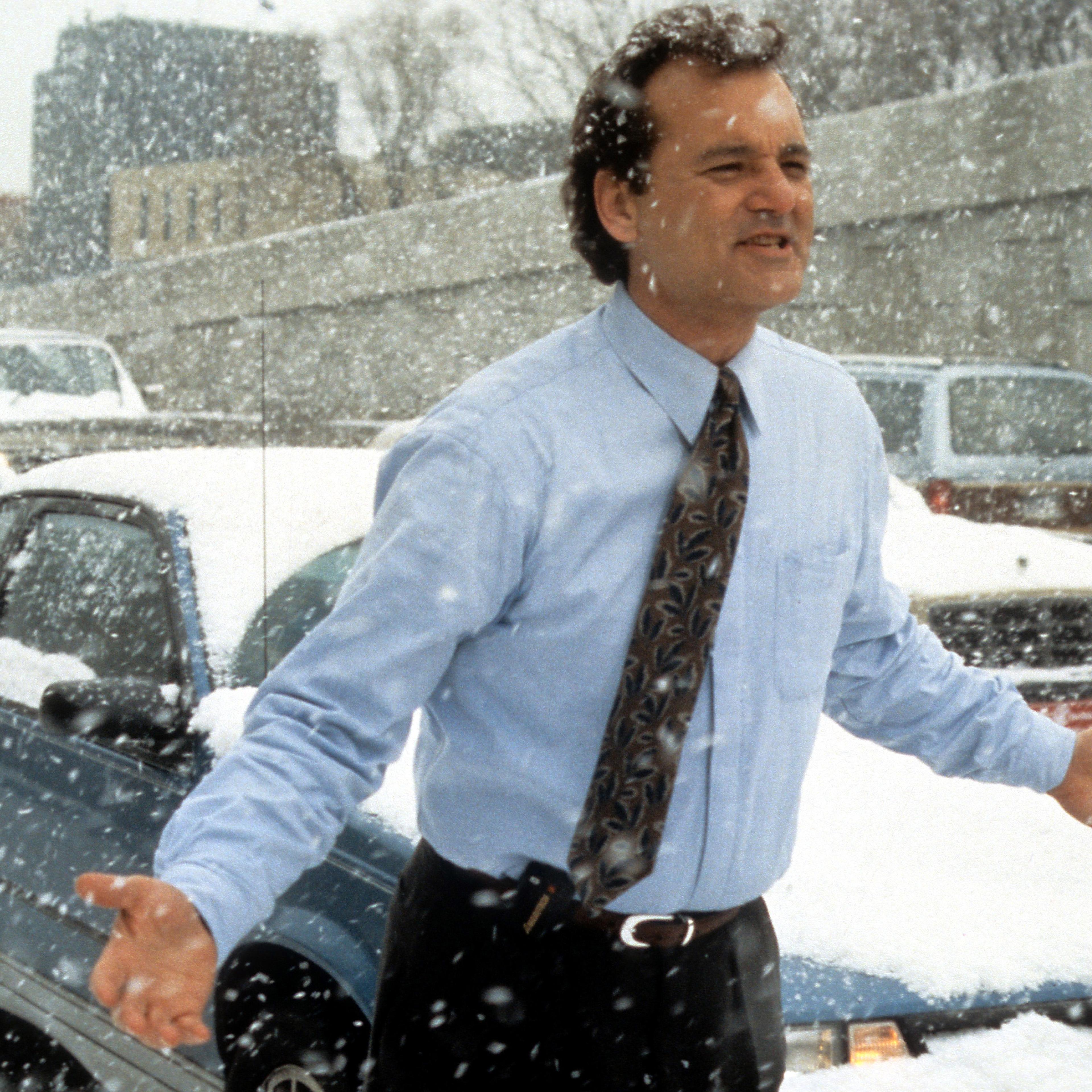 Bill Murray runs through the snow in a scene from the film Groundhog Day in 1993.