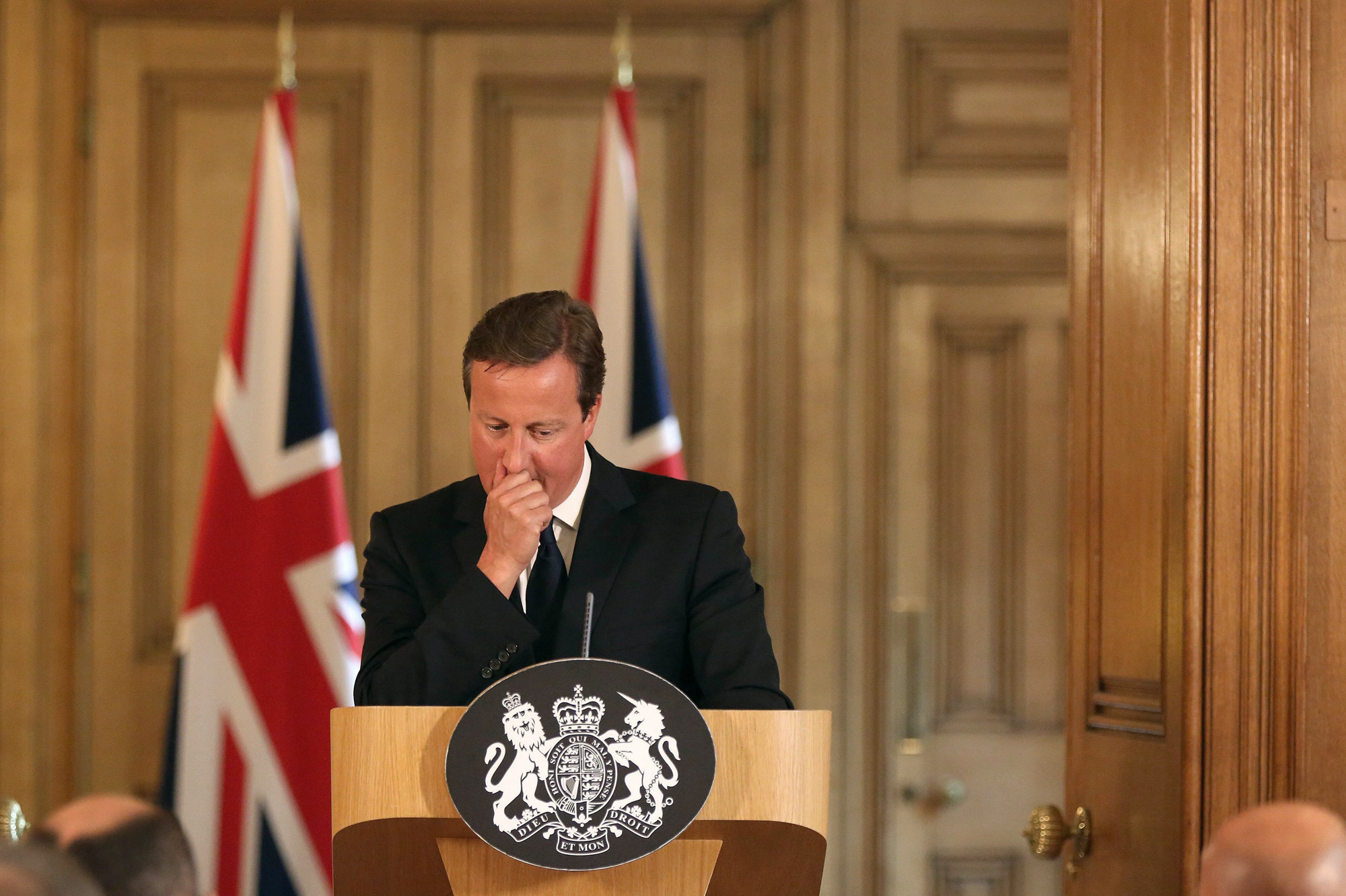 Britain's Prime Minister David Cameron pauses at a news conference in Downing Street, central London Aug. 29, 2014.