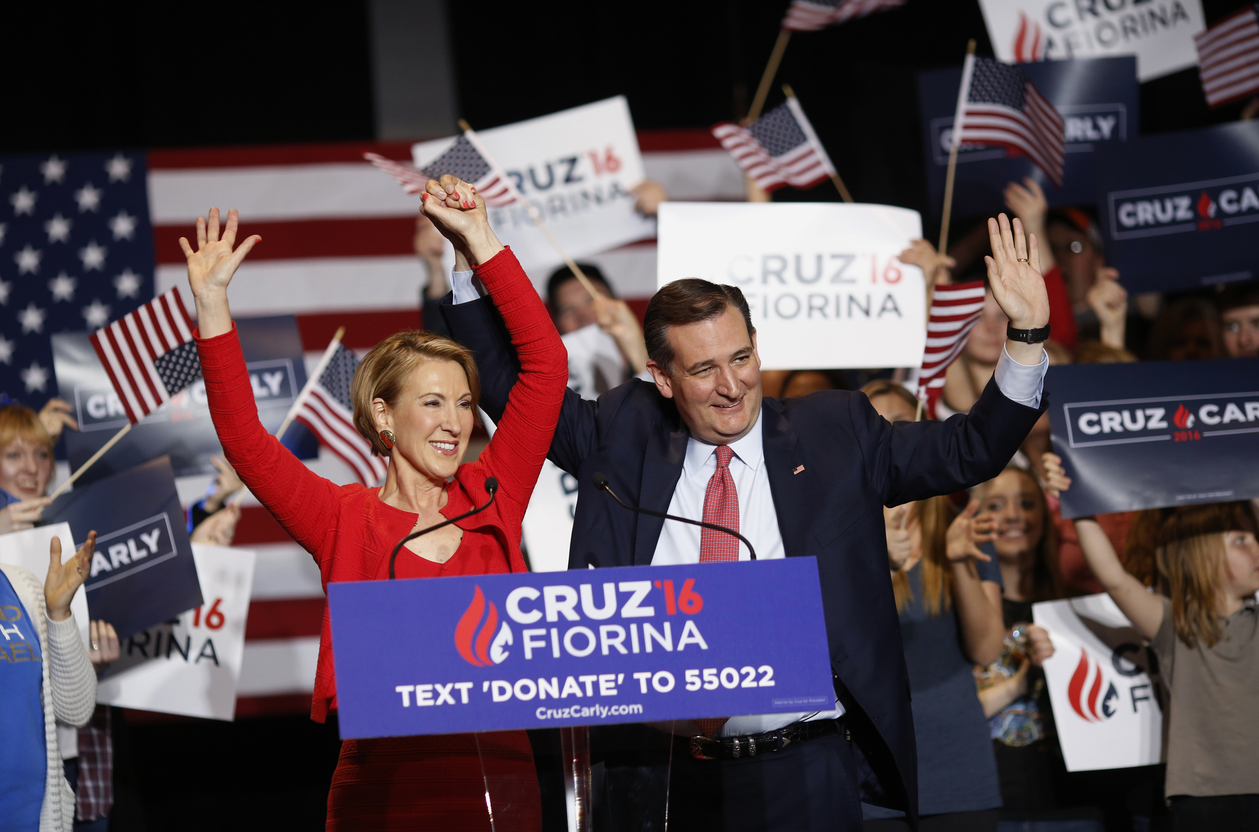 Carly Fiorina, former chairman and chief executive officer of Hewlett-Packard Co., left, and Senator Ted Cruz, a Republican from Texas and 2016 presidential candidate, waves to attendees during a campaign rally in Indianapolis on April 27, 2016.