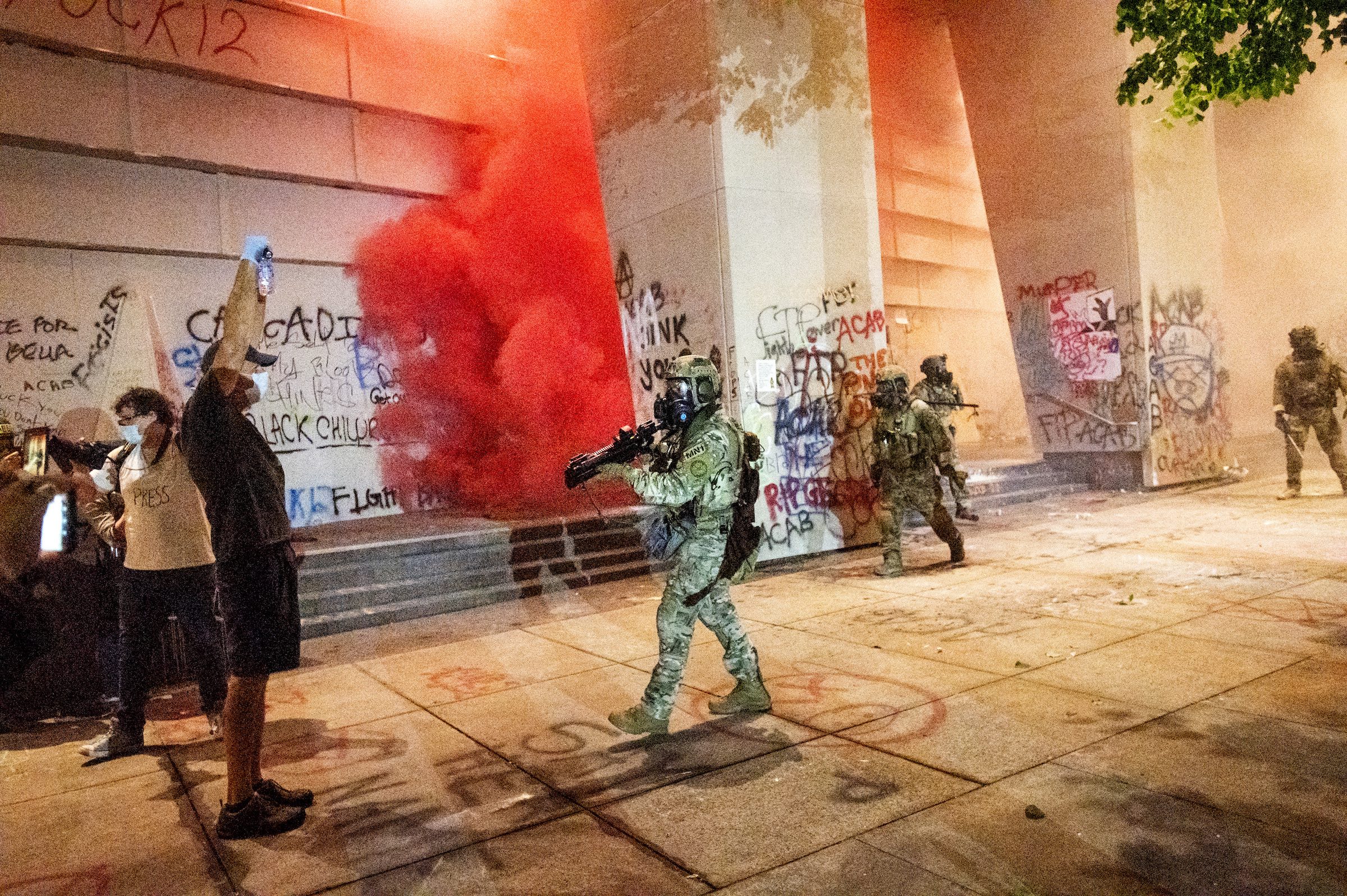 Federal officers use crowd control munitions and teargas to disperse Black Lives Matter protesters at the Mark O. Hatfield United States Courthouse in Portland, Ore. on July 21, 2020.