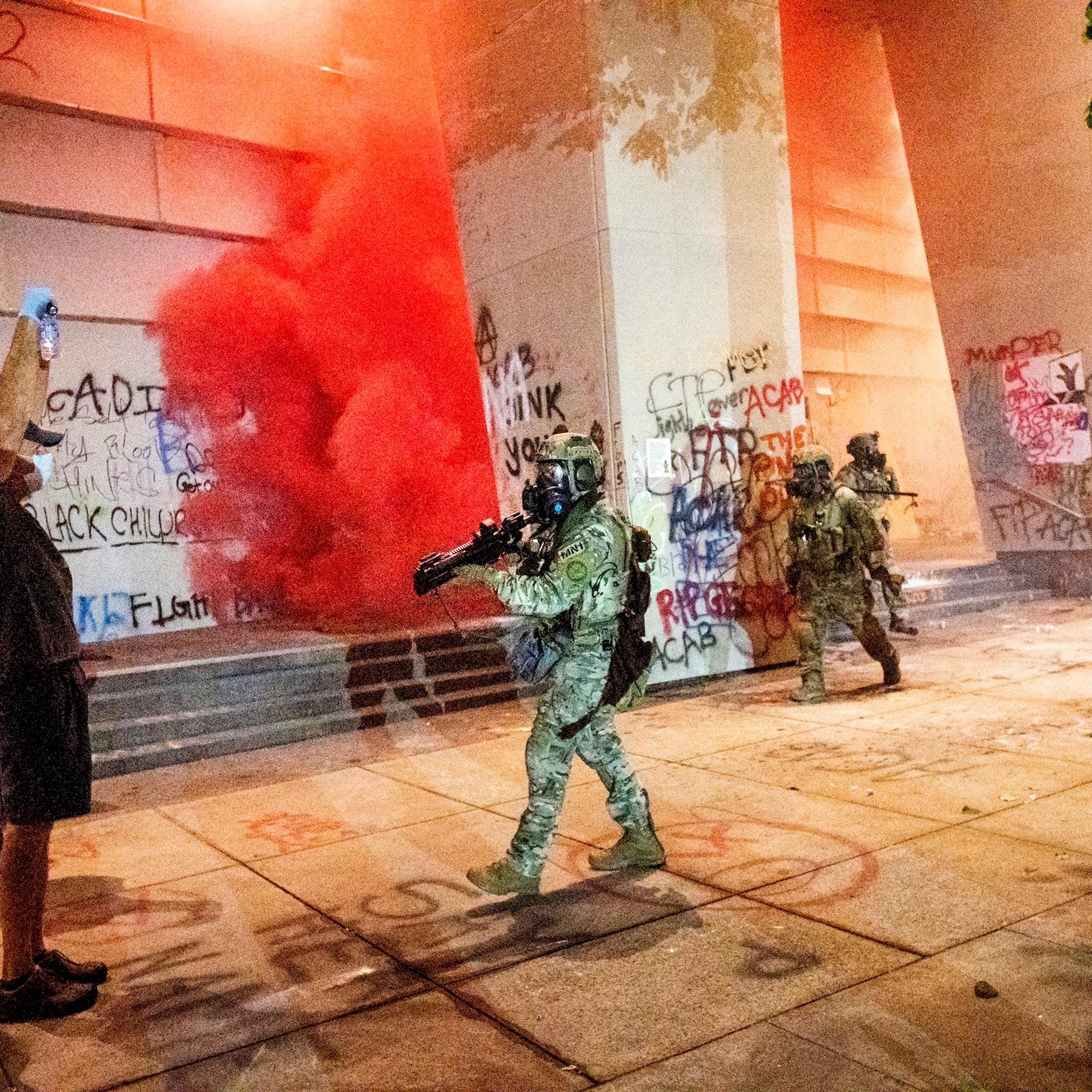 Federal officers use crowd control munitions and teargas to disperse Black Lives Matter protesters at the Mark O. Hatfield United States Courthouse in Portland, Ore. on July 21, 2020.