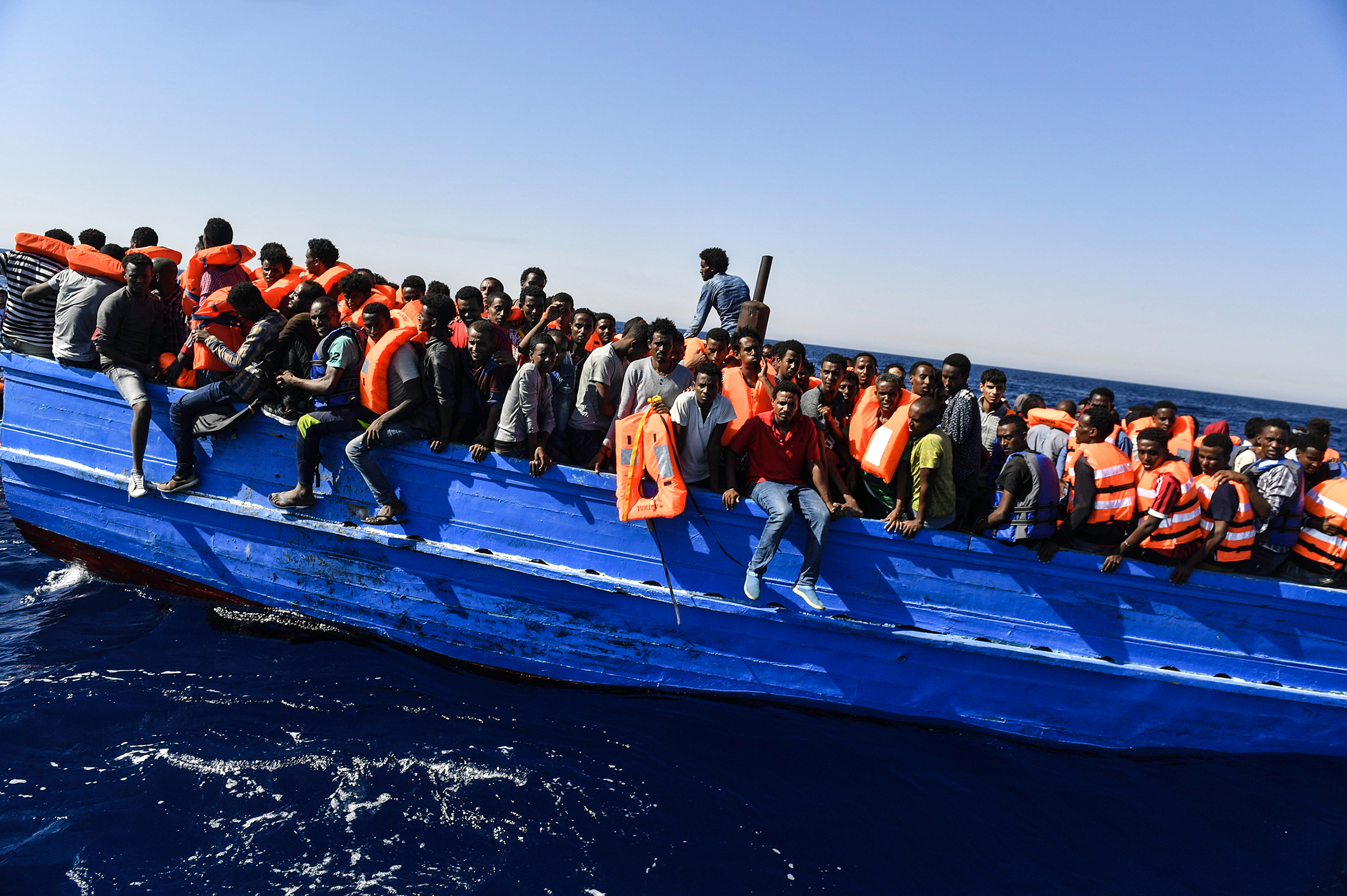 Hundreds of migrants wait to be rescued off the coast of Libya on Aug. 21, 2016.
