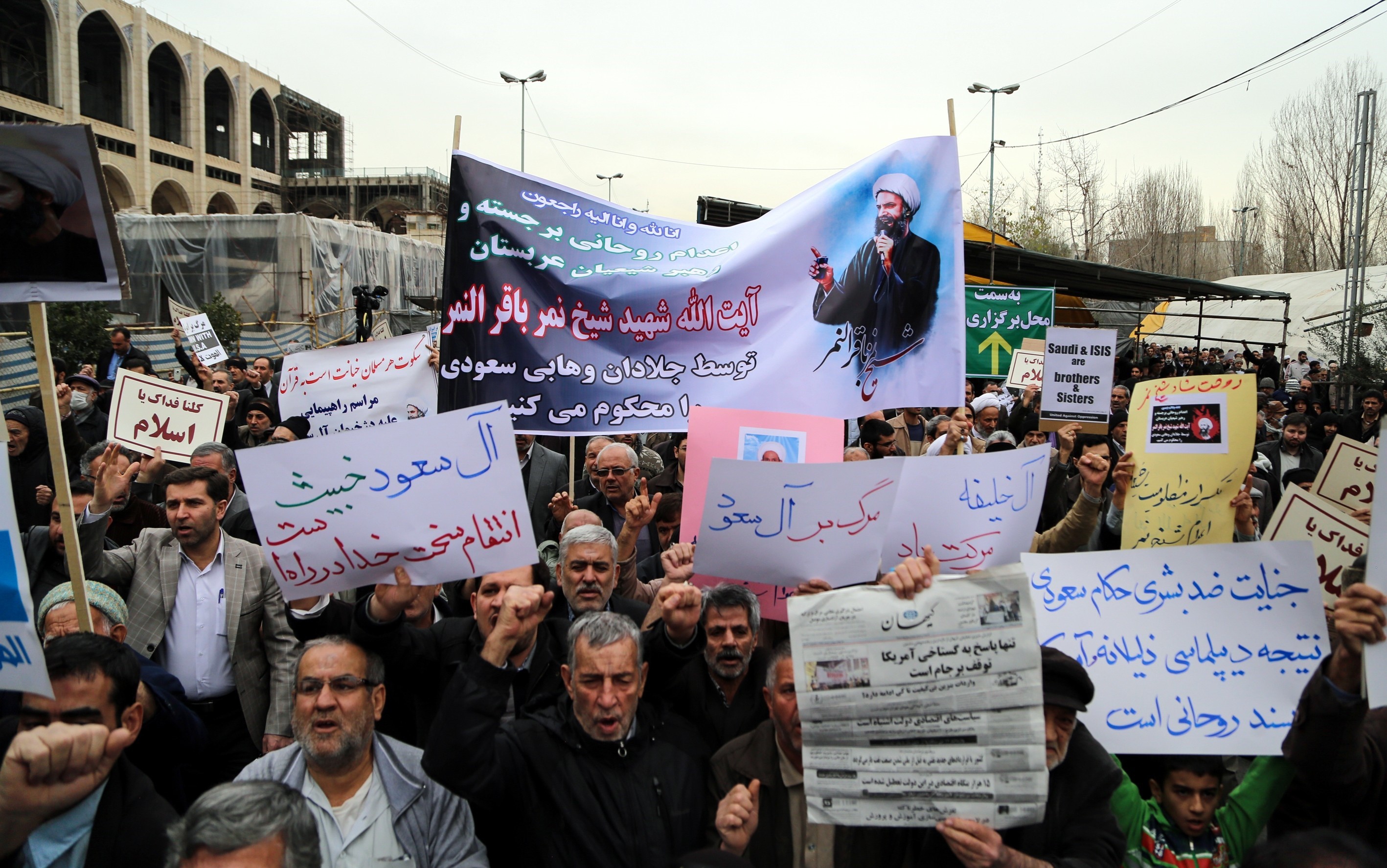 Iranian people hold banners and chant slogans against Saudi Arabia during the protest against execution of prominent Shiite cleric Nimr al-Nimr by Saudi authorities, after friday prayer in Tehran on Jan. 8, 2016.