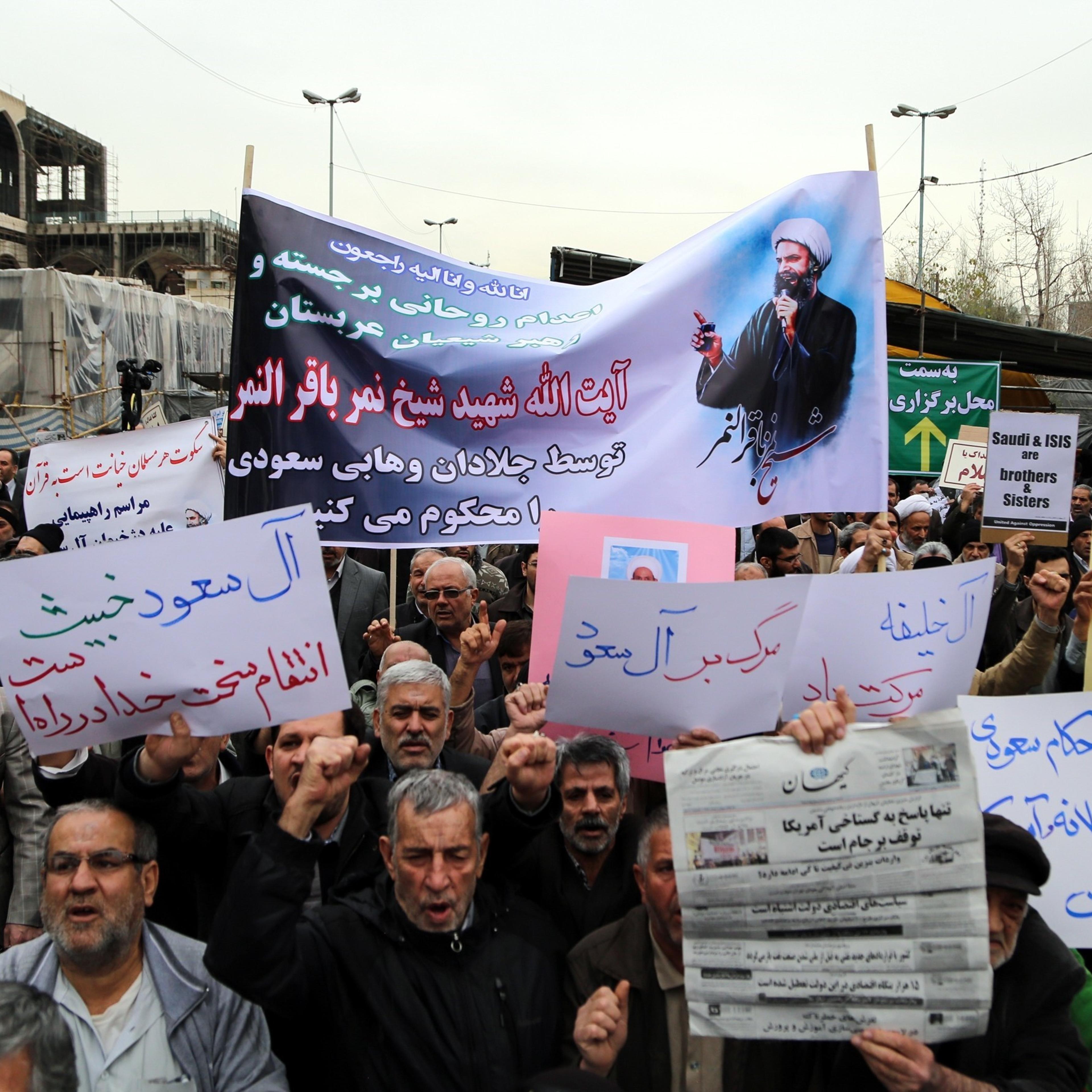 Iranian people hold banners and chant slogans against Saudi Arabia during the protest against execution of prominent Shiite cleric Nimr al-Nimr by Saudi authorities, after friday prayer in Tehran on Jan. 8, 2016.