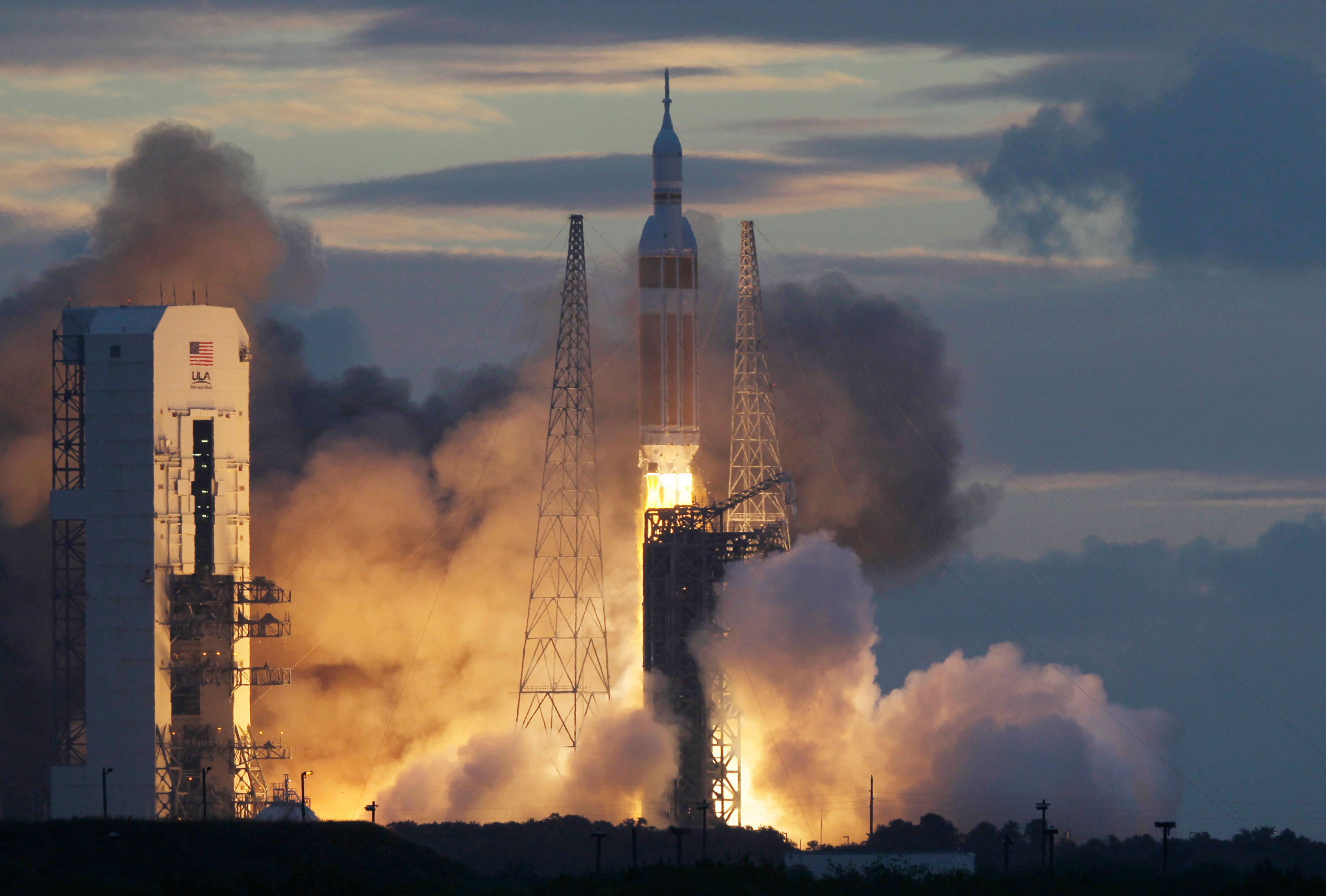 NASA's Orion spacecraft, atop a United Launch Alliance Delta 4-Heavy rocket, lifts off on its first unmanned orbital test flight from the Cape Canaveral Air Force Station on Dec. 5, 2014, in Cape Canaveral, Fla.