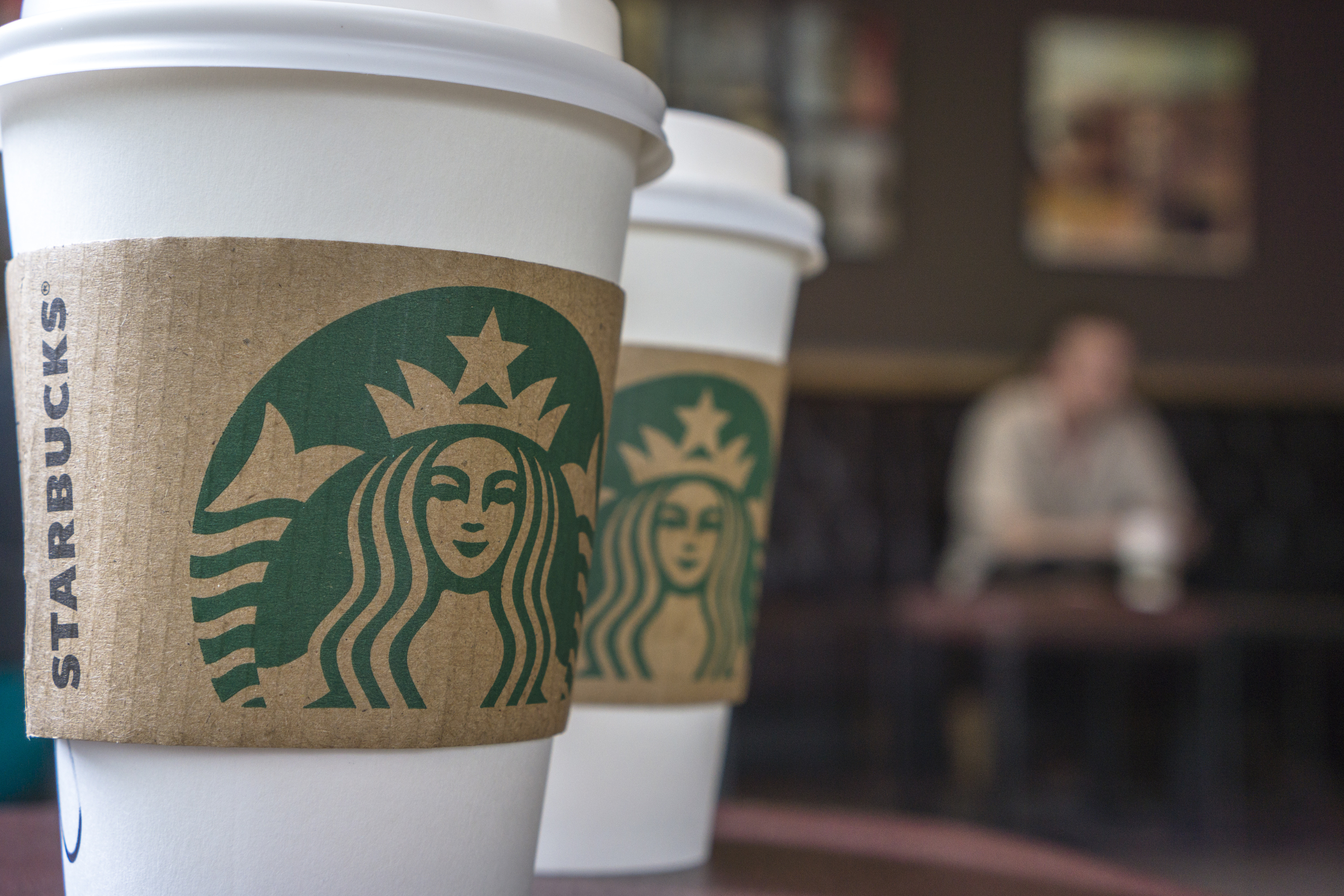 Coffee cups on the table in a Starbucks shop.  Last Thursday