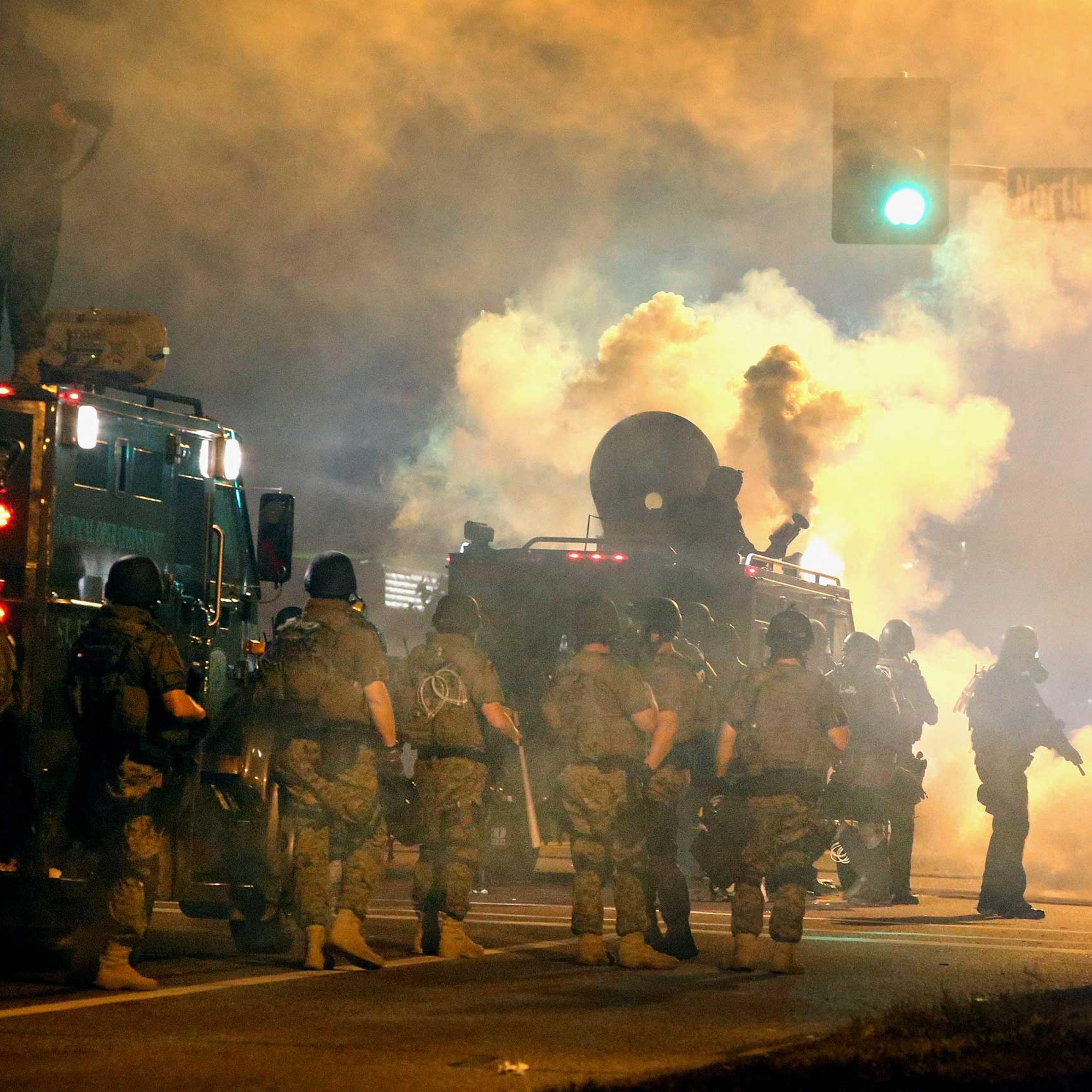Police and Missouri National Guard attempt to control demonstrators protesting the killing of teenager Michael Brown on Aug. 18, 2014 in Ferguson, Mo.