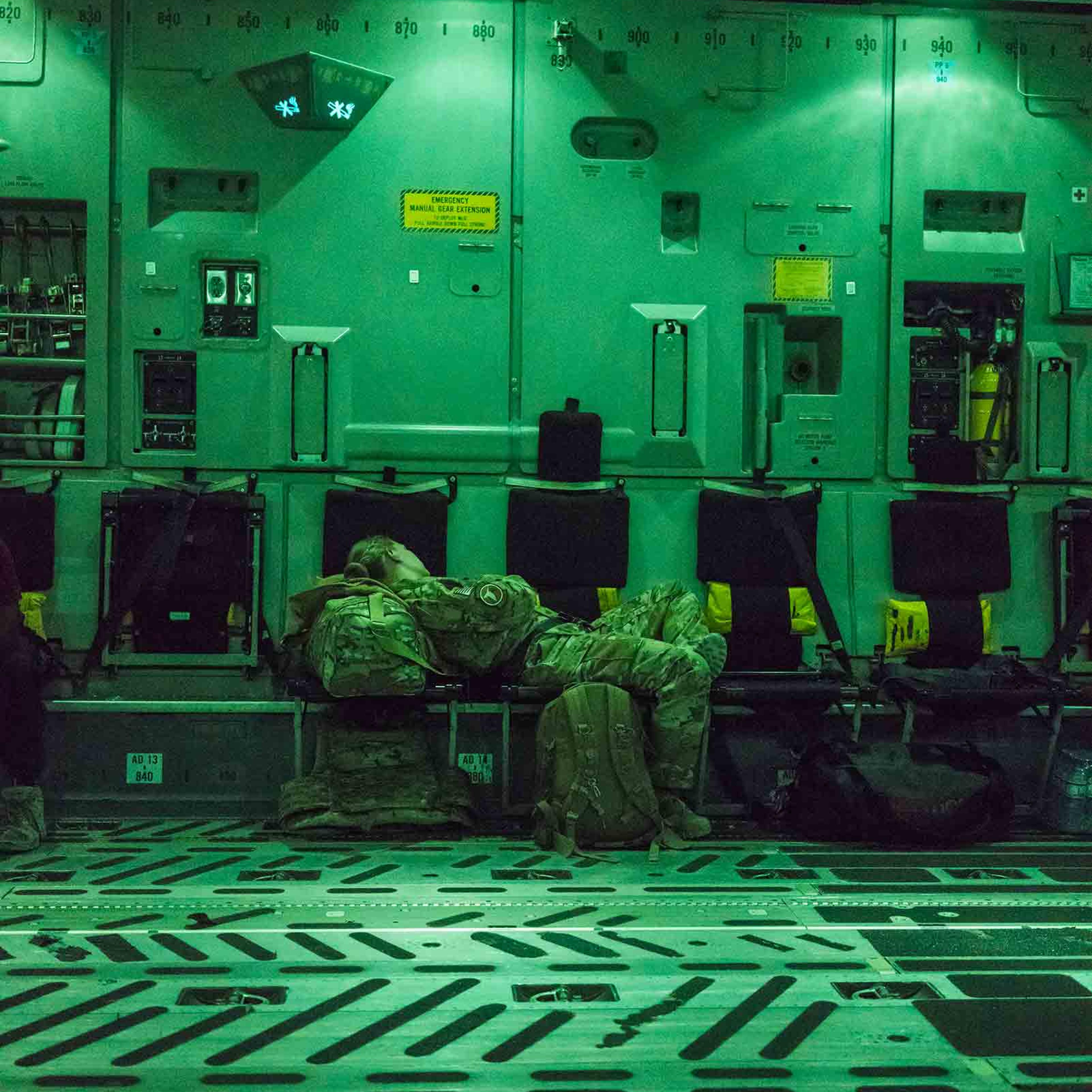 A U.S. soldier rests on a flight to Kabul in August 2018. The war in Afghanistan is nearly two decades old.
