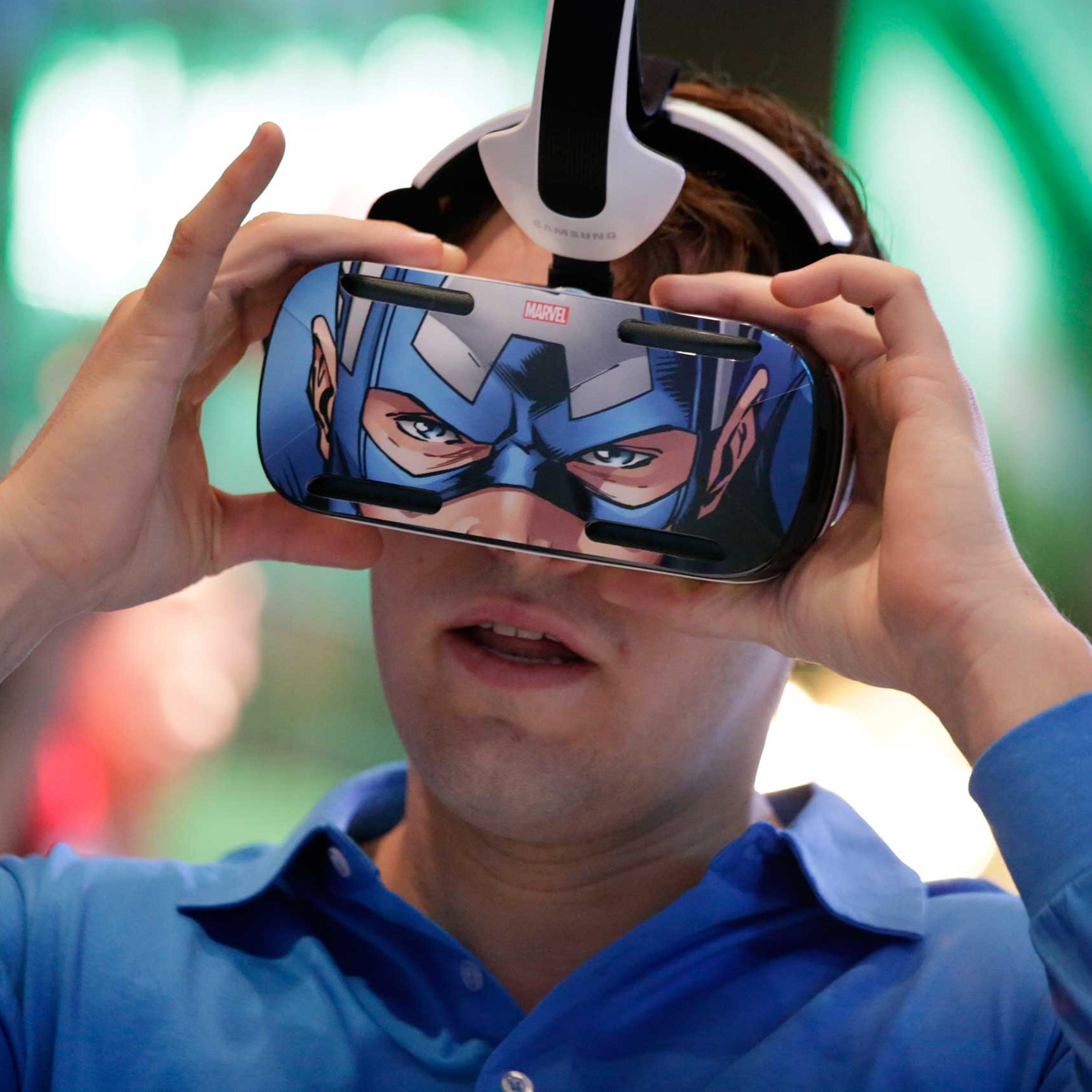 A brand ambassador tests Samsung's Gear VR headset at the Samsung Galaxy booth at the International CES on Jan. 6, 2015, in Las Vegas.