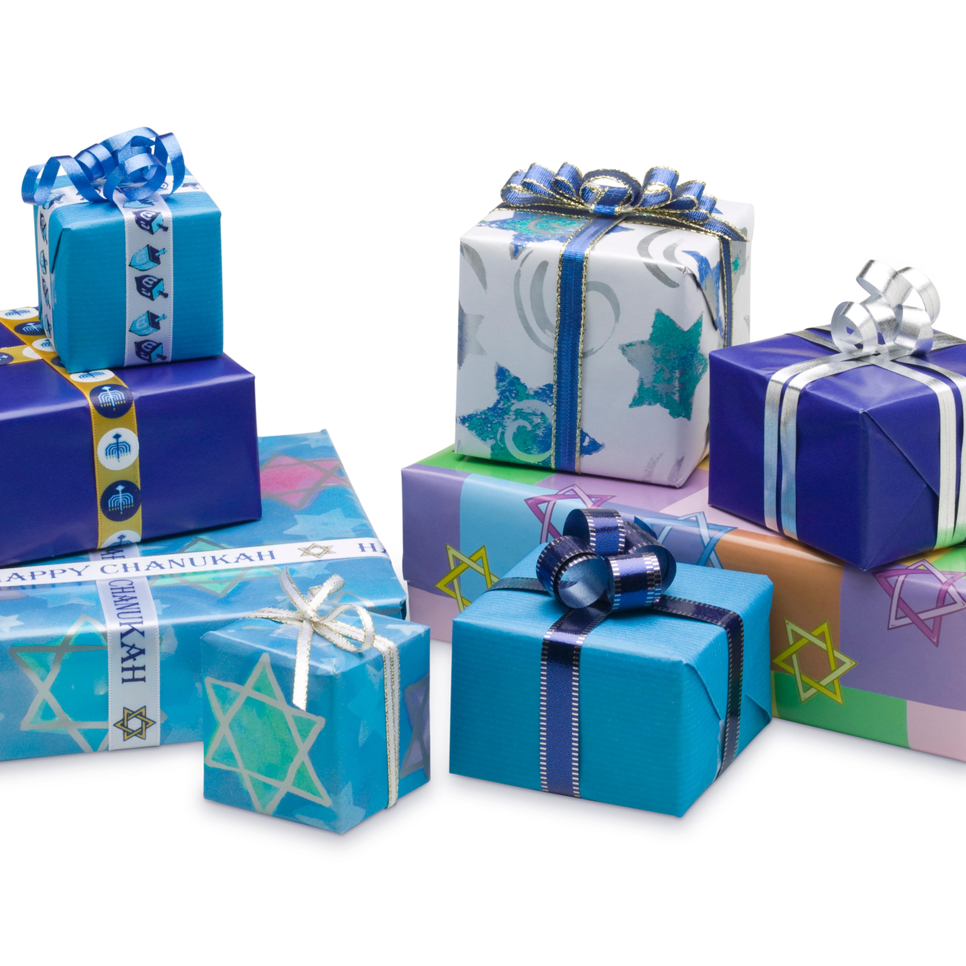 Selection of blue wrapped Hanukkah gifts isolated on white