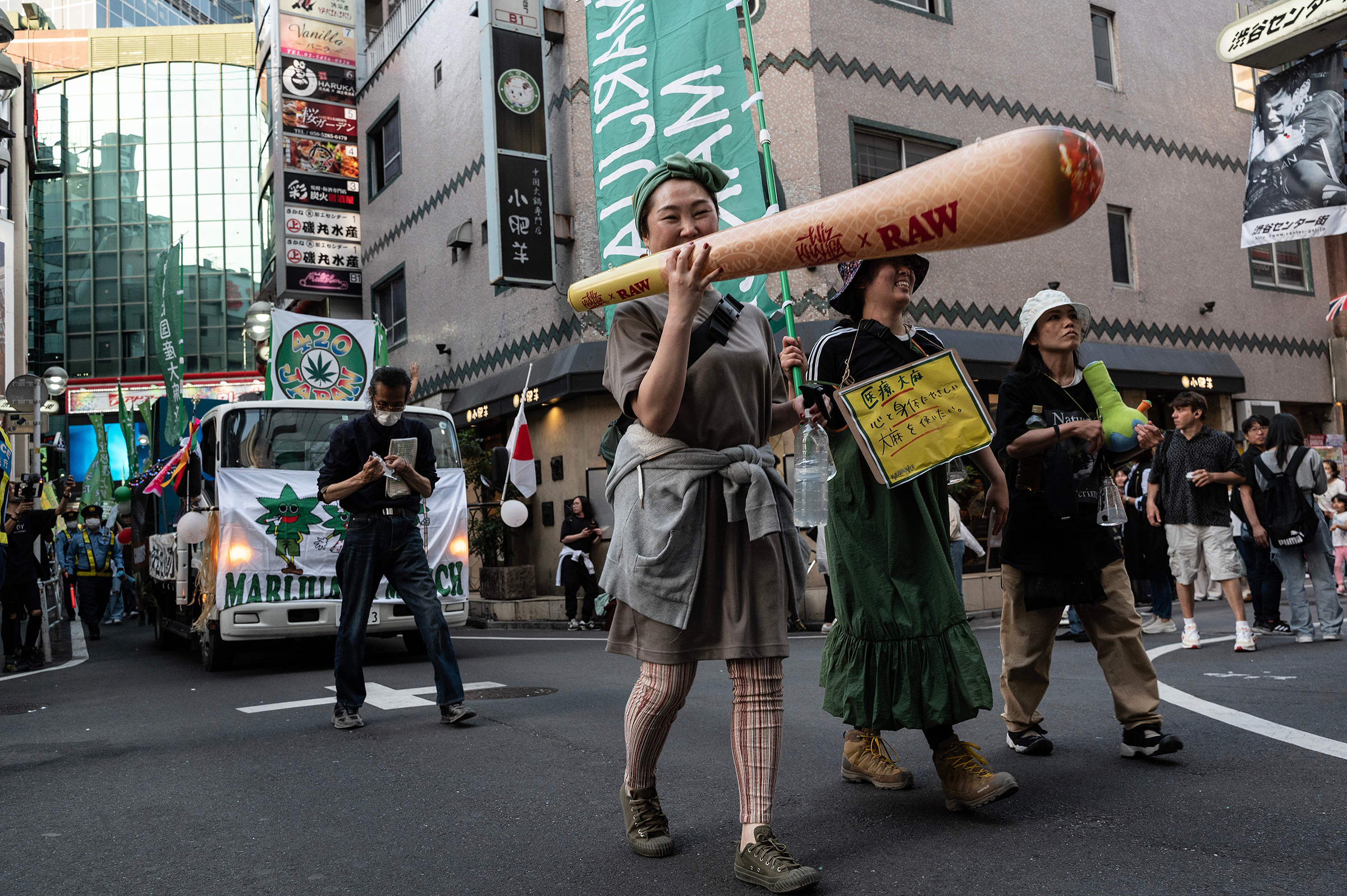 People take part in a march to call for the legalization of cannabis in the streets of Shibuya in Tokyo on May 4.