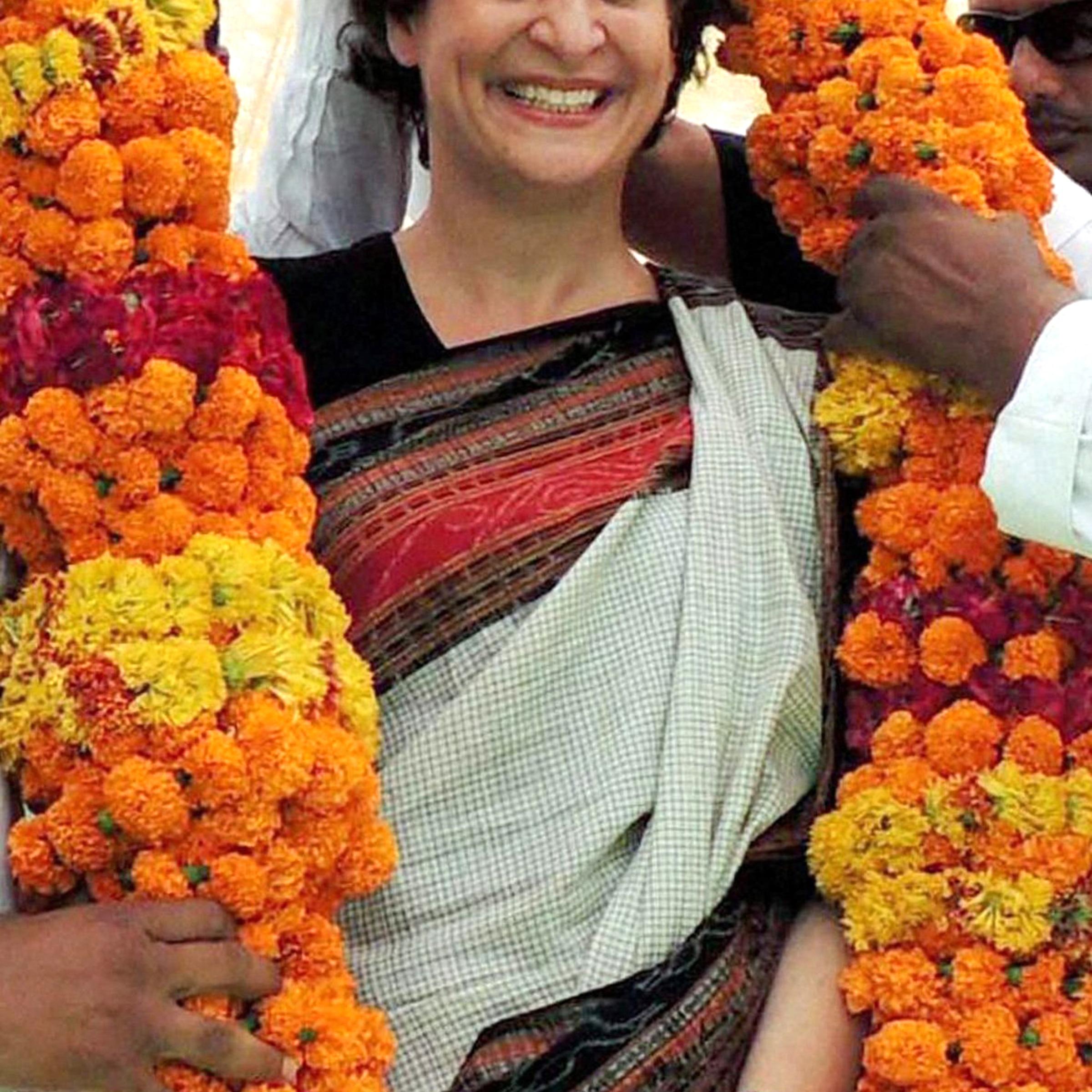 Priyanka Vadra, daughter of Congress party president Sonia Gandhi, receives a giant garland during an election campaign in her motherís constituency of Rae Bareli, India, on April 22, 2014.