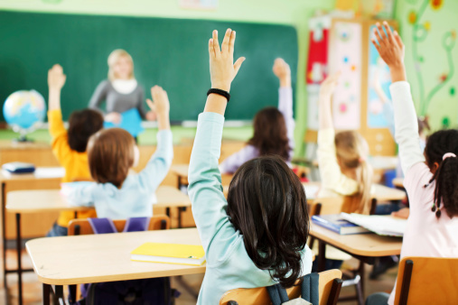 students-raising-hands-classroom