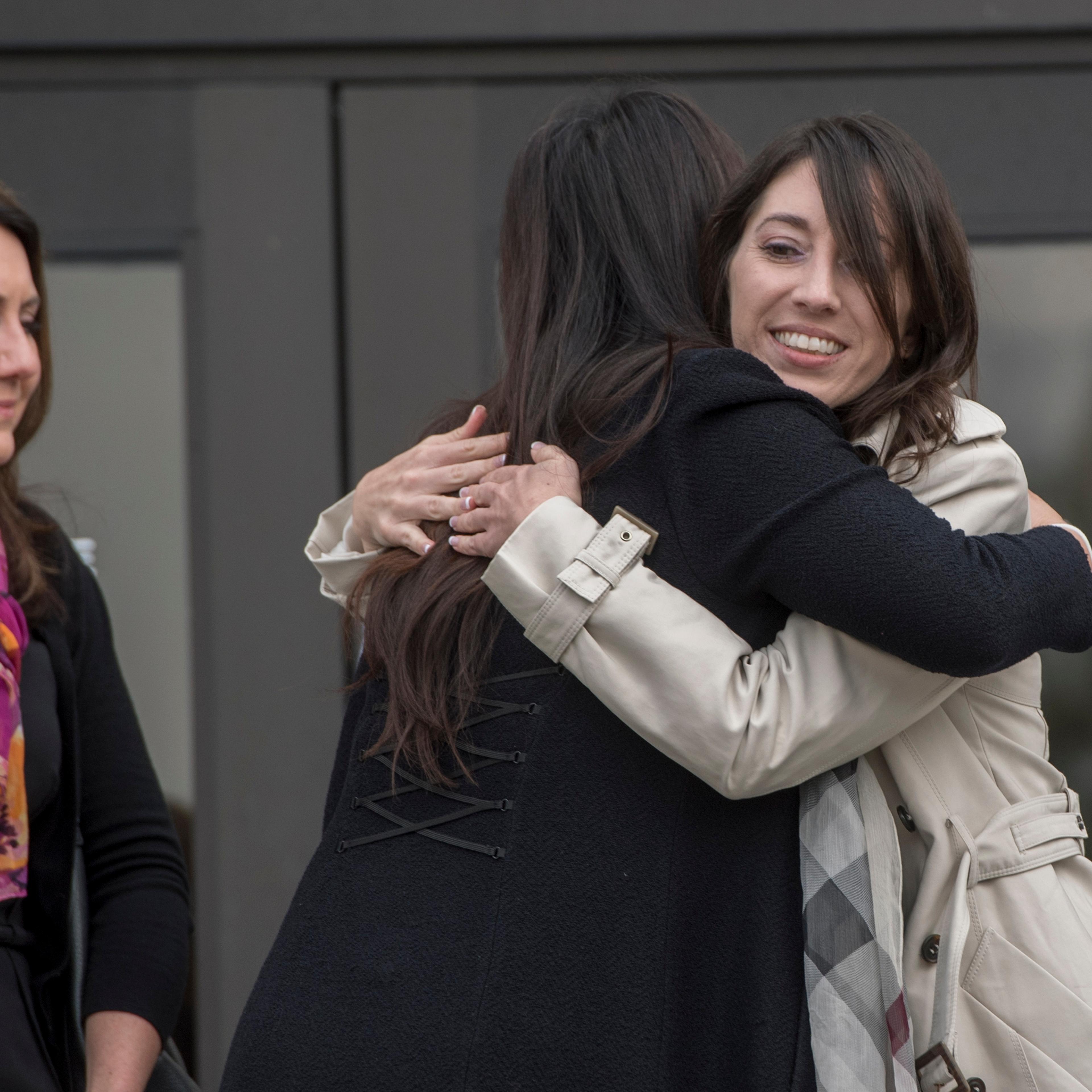 Michelle Susan Hadley, right, hugs Orange County District Attorney Chief of Staff Susan Kang Schroeder after being cleared of all charges in a complicated plot to frame her in Fullerton, Calif., on Jan. 9, 2017.