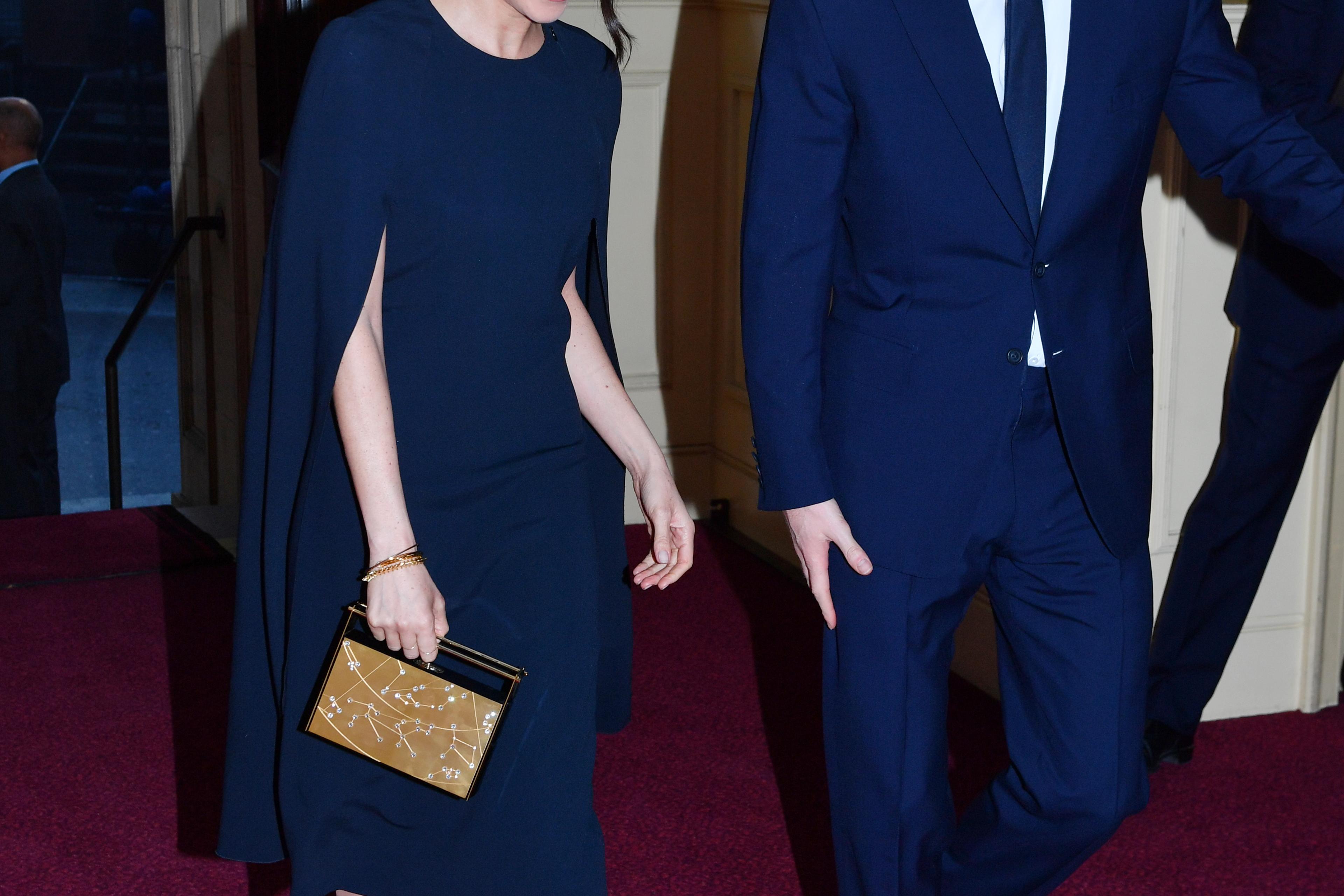 harry and meghan blue dress Meghan Markle Wore a Stunning Blue Dress in London